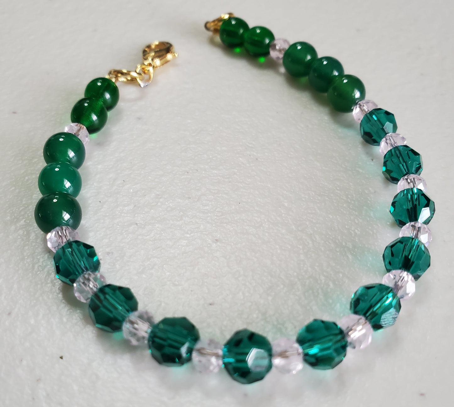 Elegant emerald and rose crystal jewelry set with necklace and bracelet handcrafted with Austrian crystals