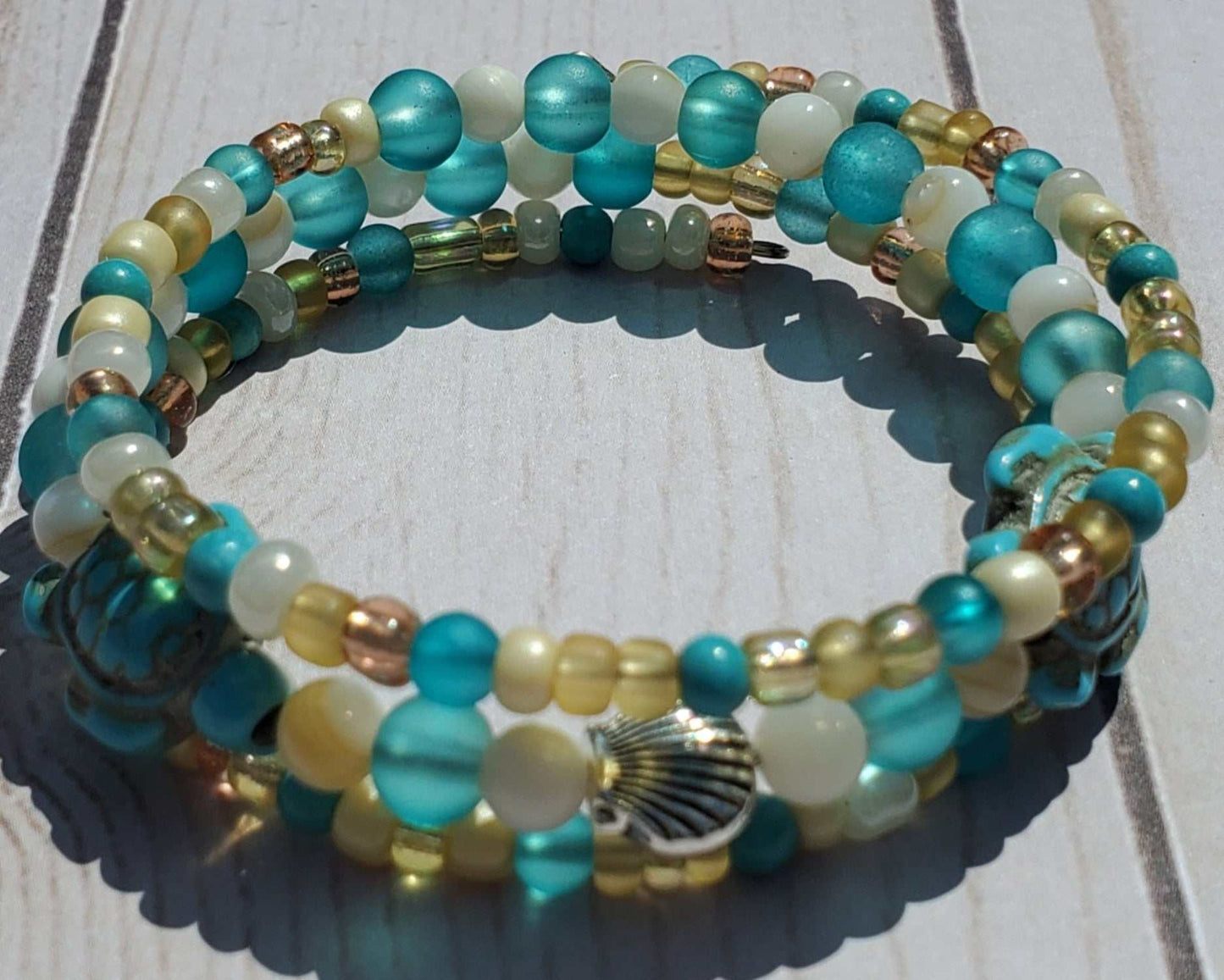 Sea Turtle cuff bracelet with Howlite beads, gemstone accents, and pewter seashell charm on memory wire