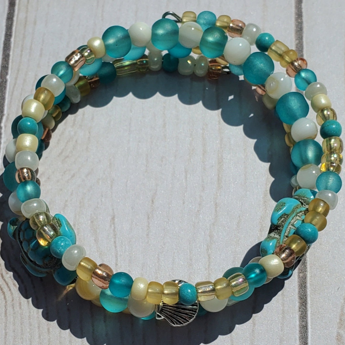 Multicolored beaded bracelet on a wooden surface