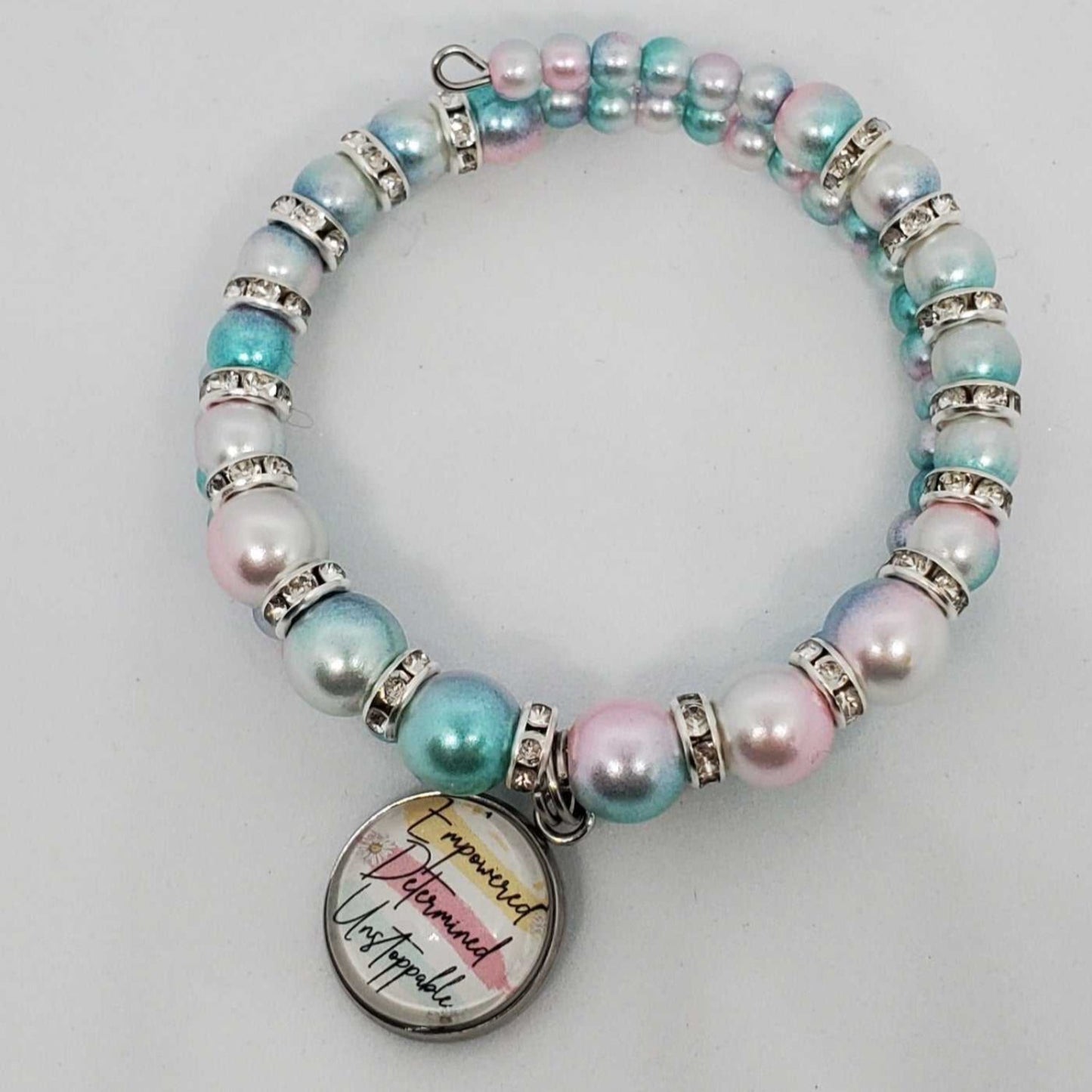 Kids charm bracelet with ombre acrylic pearls, rhinestone spacers, and motivational "Empowered, Determined, Unstoppable" charm