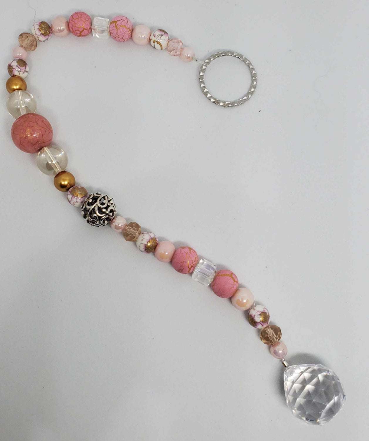 Pink marble crystal suncatcher with teardrop prism, gold accents, pearls, and crystals hanging ornament