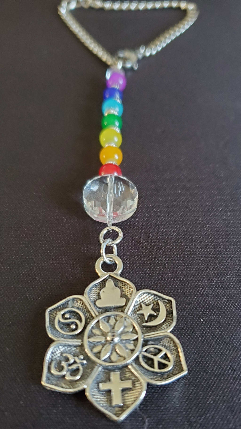Rearview Mirror Car Charm with Co-Exist pewter charm and colorful Chakra beads hanging in car interior