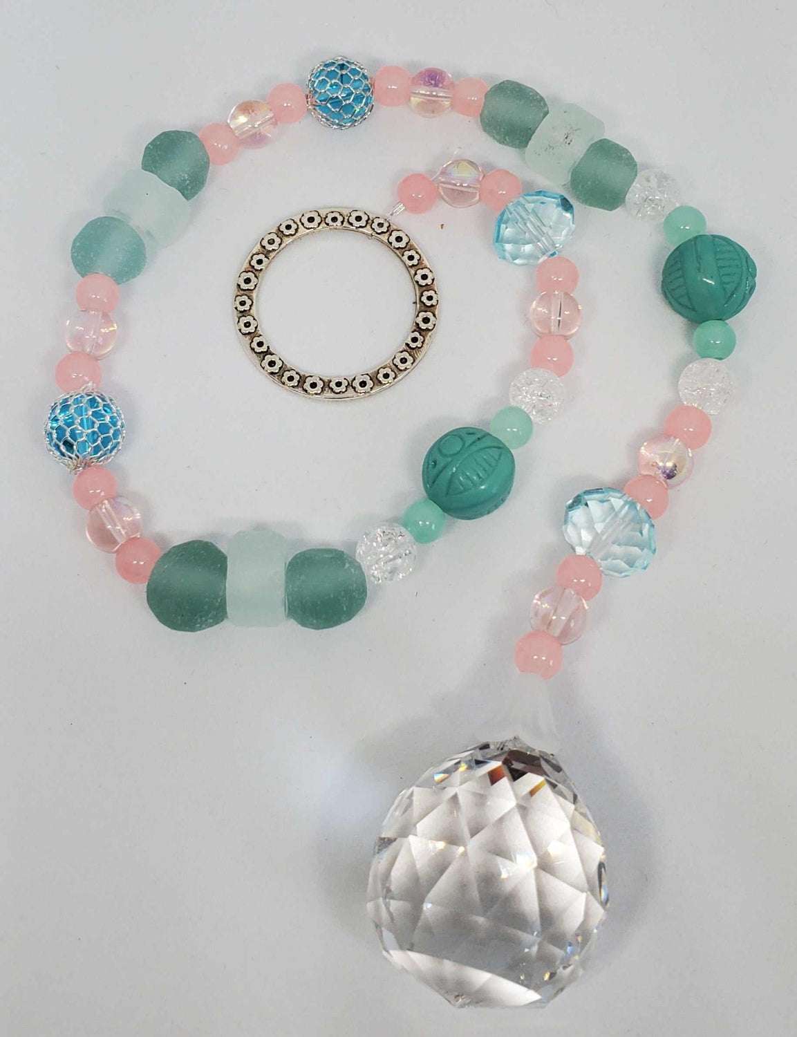 Crystal Suncatcher Bahama Beach with pink and turquoise sea glass beads and 30mm prism crystal hanging on a metal ring