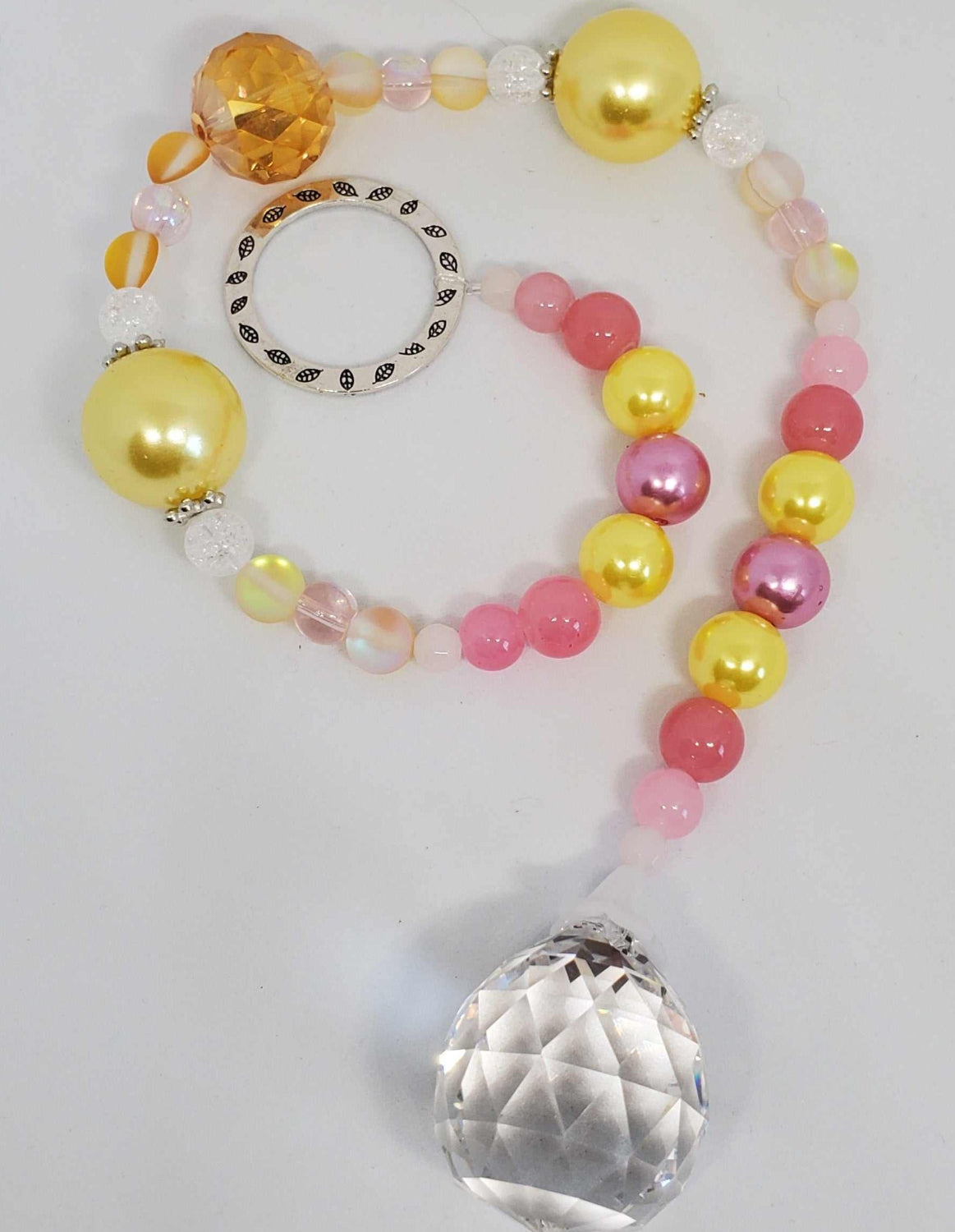 Crystal Suncatcher with pink and yellow beads and a large faceted prism crystal pendant