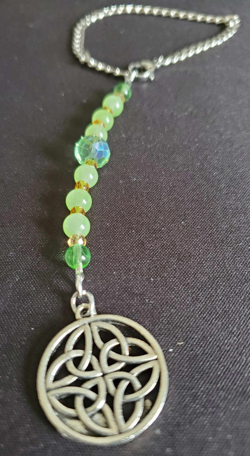 Rearview mirror car charm featuring a pewter Celtic Dara Knot and green glass beads on a silver chain