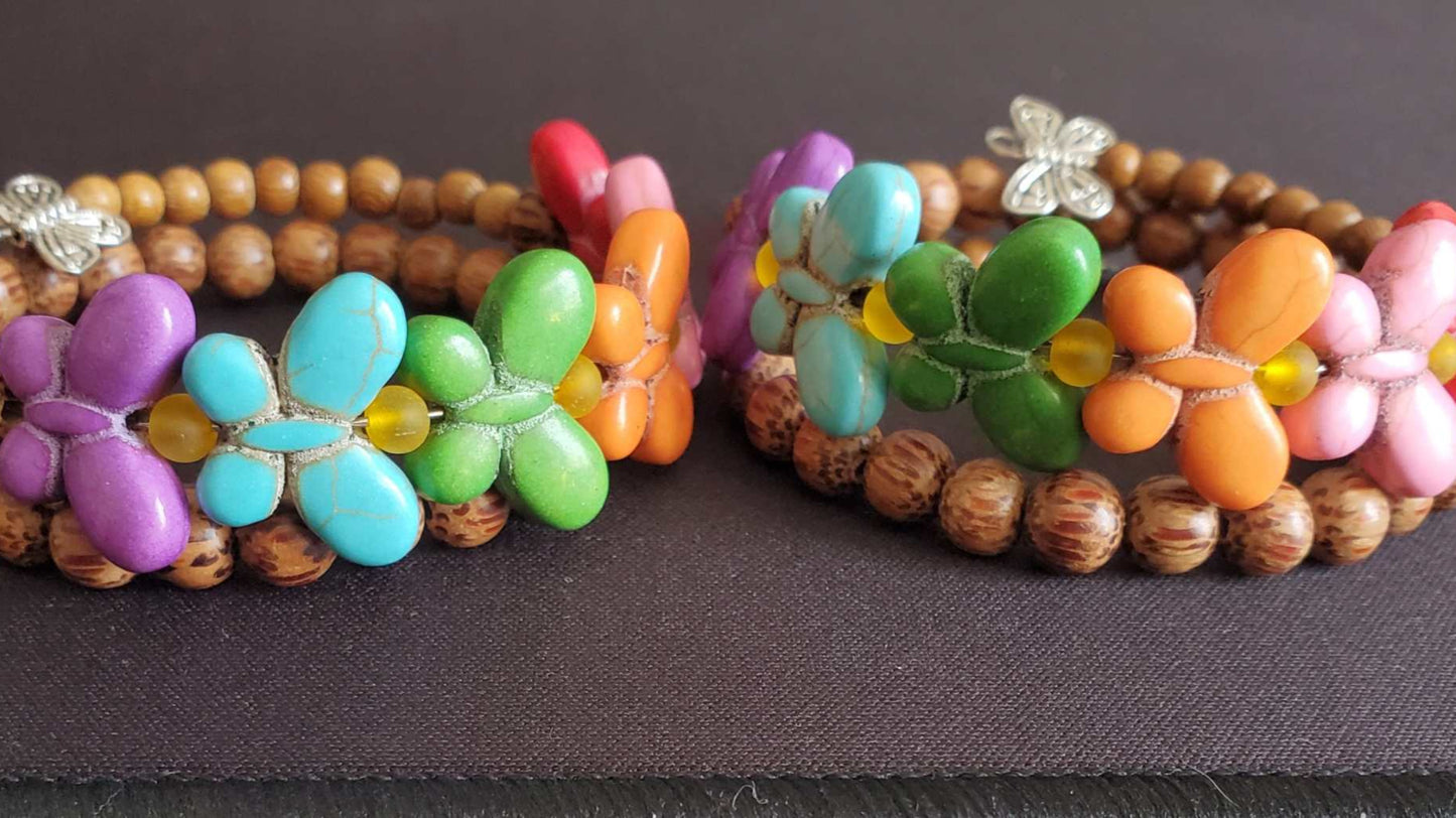 Colorful Bohemian Bracelet with butterfly-shaped Howlite beads and natural wood accents on flexible memory wire