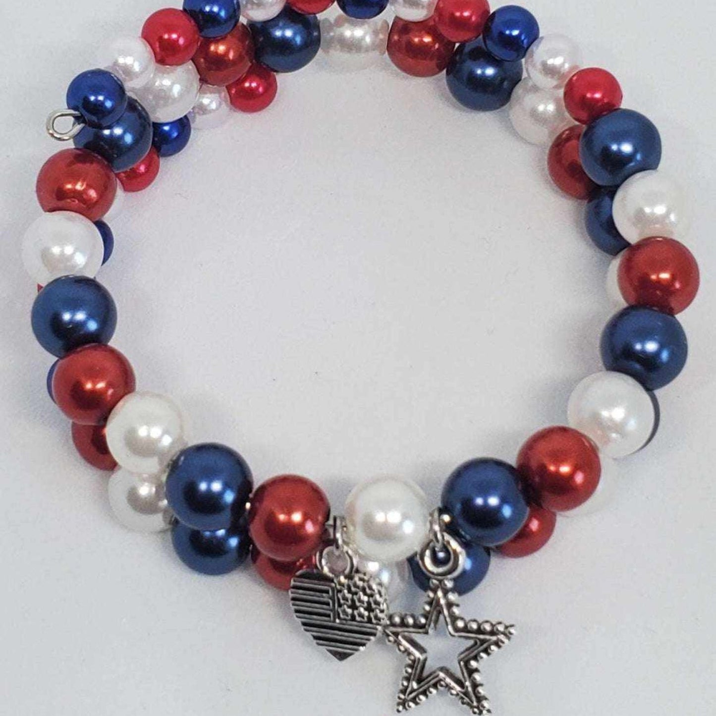 Red white and blue cuff charm bracelet with stars, hearts, and pearls for 4th of July celebration