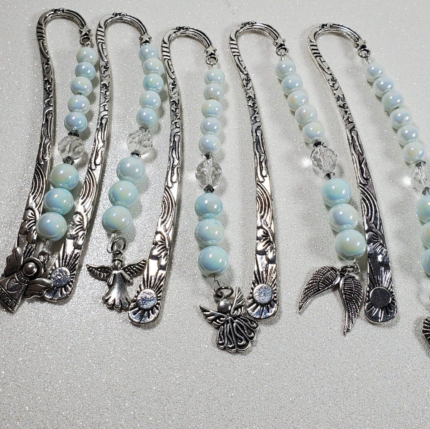 Set of handcrafted Angel Bookmark with silver shepherd hooks, blue glass beads, clear prism accents, and pewter angel charms for memorial and religious gifts