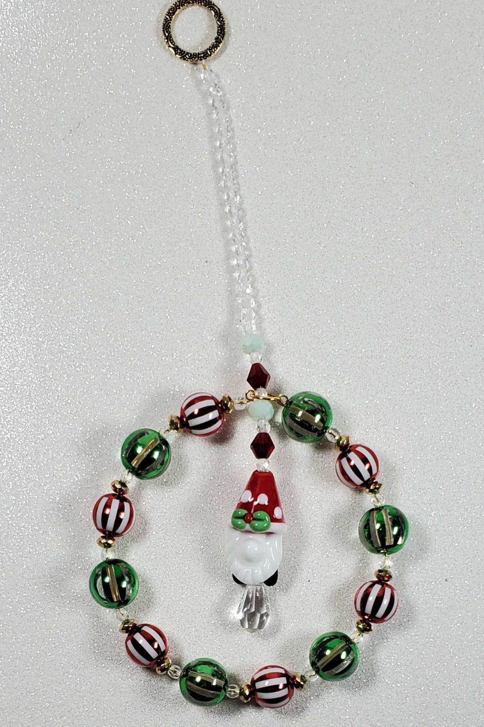 Holiday Ornament featuring a Santa Gnome beaded suncatcher with colorful glass beads and a teardrop prism.