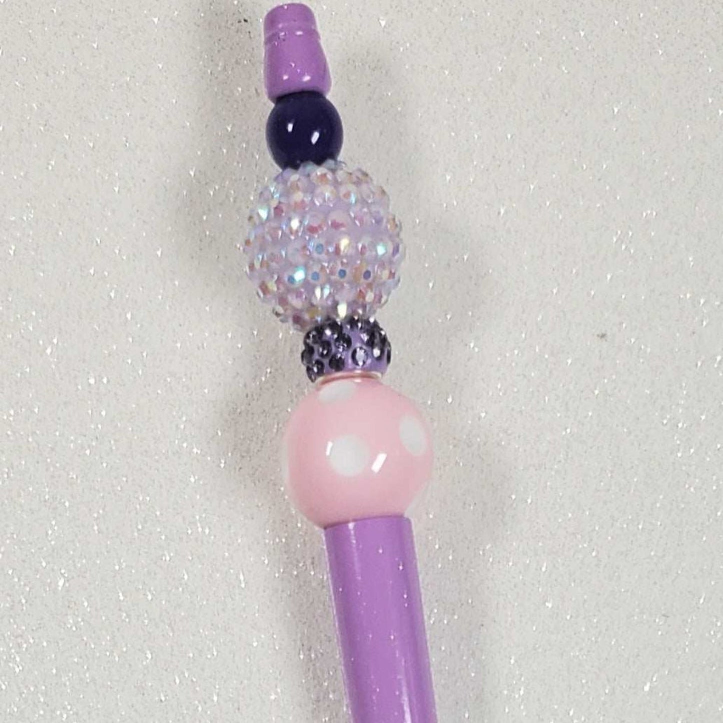 Purple decorative pen with acrylic gumball beads and pearl accents inspired by Barbie style
