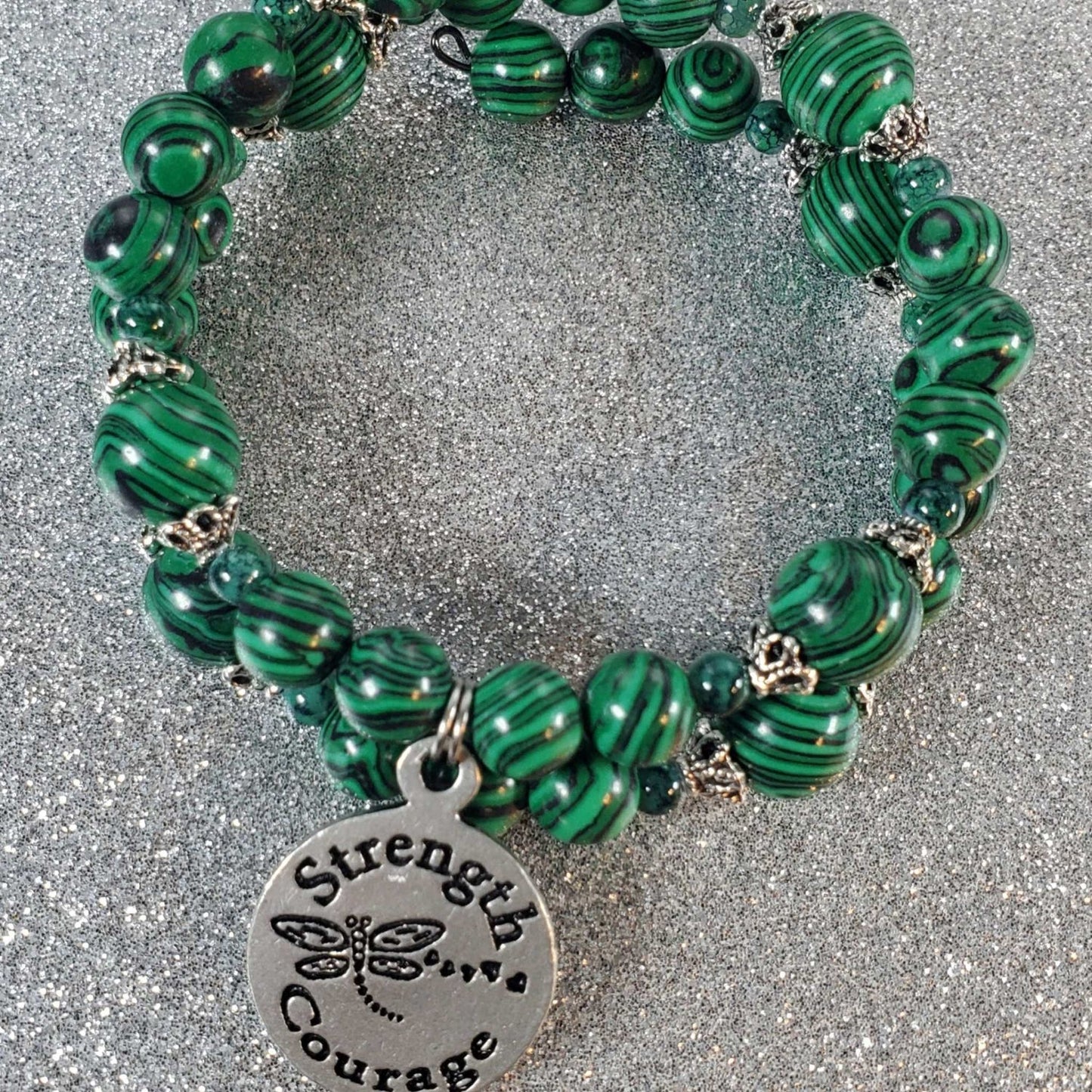 Green malachite gemstone bracelet with "Strength & Courage" pewter charm on flexible memory wire band
