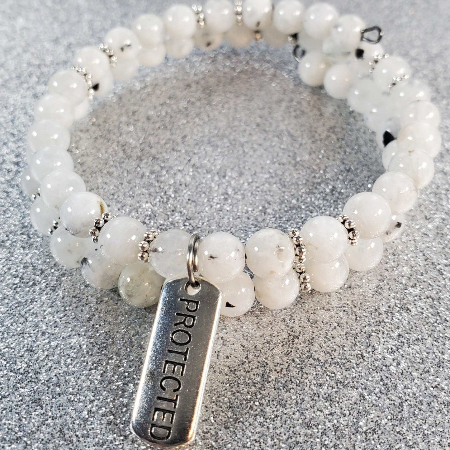 Handcrafted gemstone bracelet with protective charm and adjustable memory wire band for stylish spiritual protection