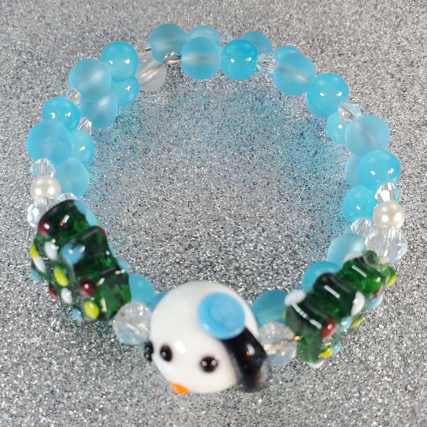 Child's holiday bracelet with blue beads and snowman charm