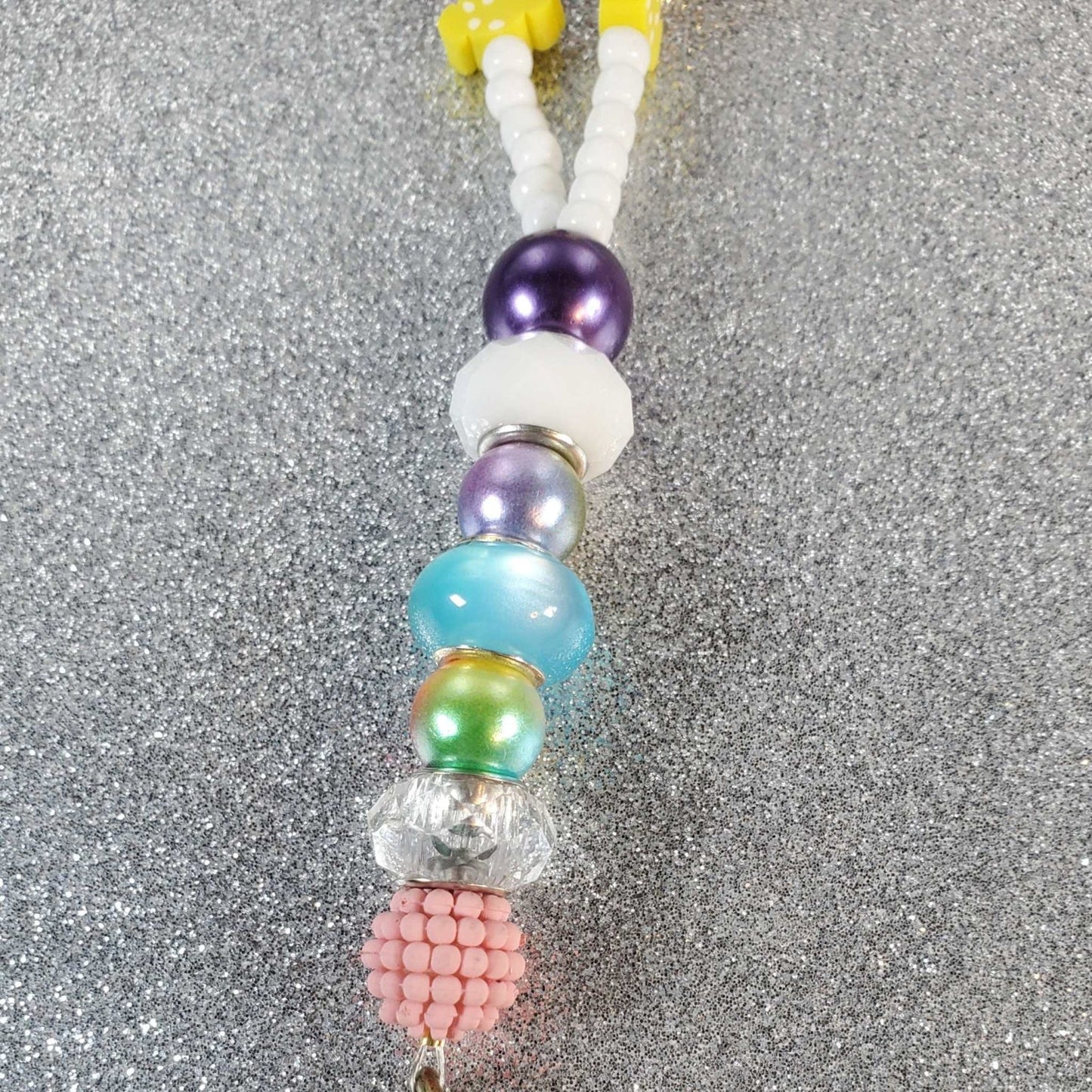 Sweet Shoppe lanyard with colorful polymer clay treats, pastry-inspired beads, Czech glass seed beads, and a brass dog clip.