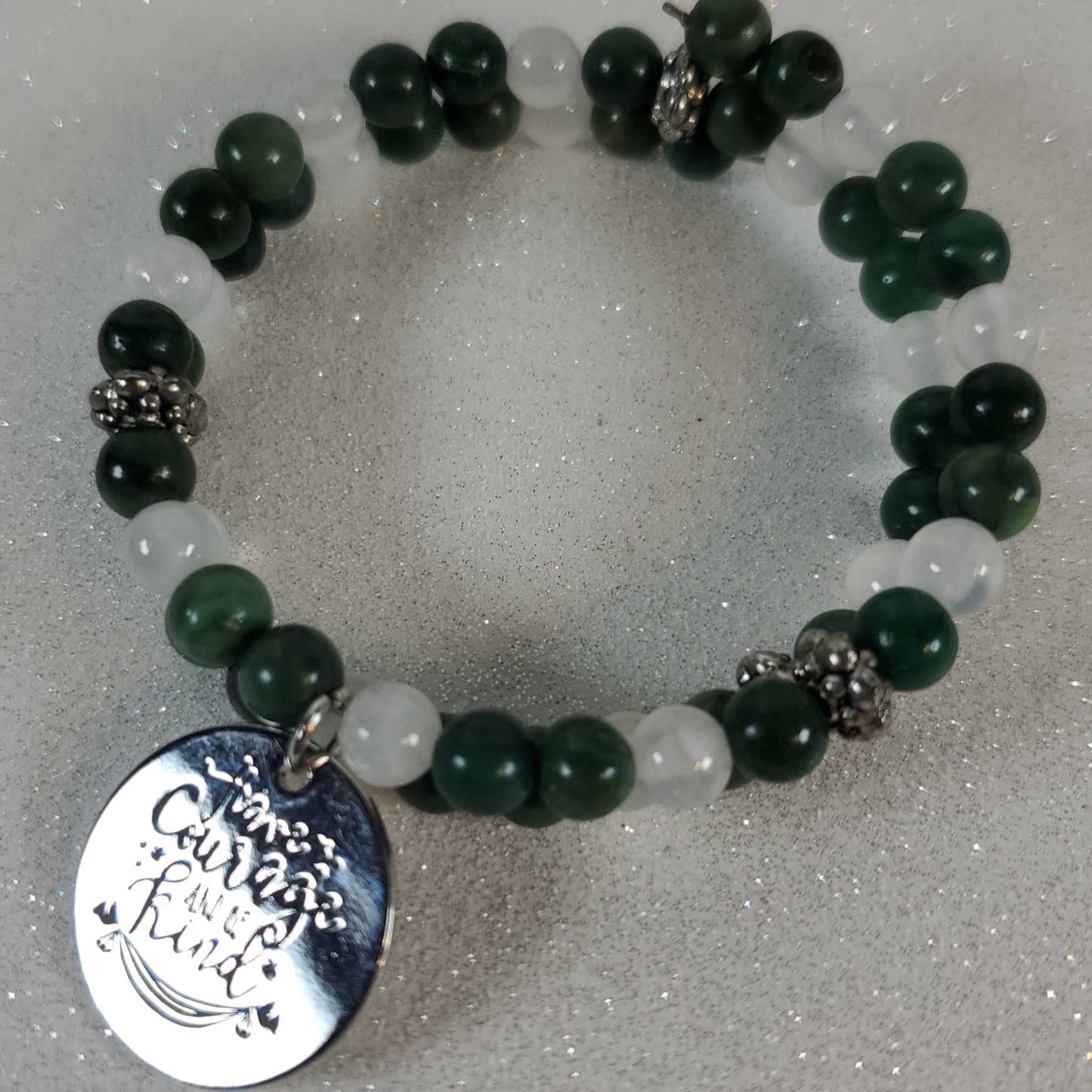 Green jade and selenite gemstone bracelet with "Have Courage Be Kind" pewter charm on memory wire