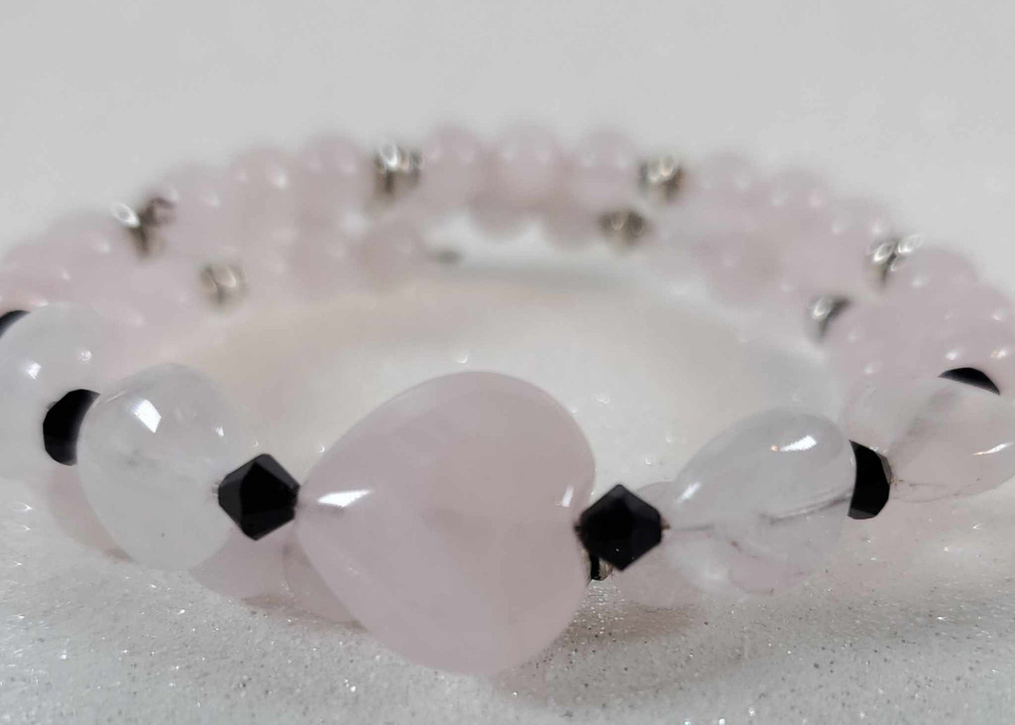 Rose Quartz heart cuff gemstone bracelet with round beads, black Austrian crystals, and pewter accents on memory wire.