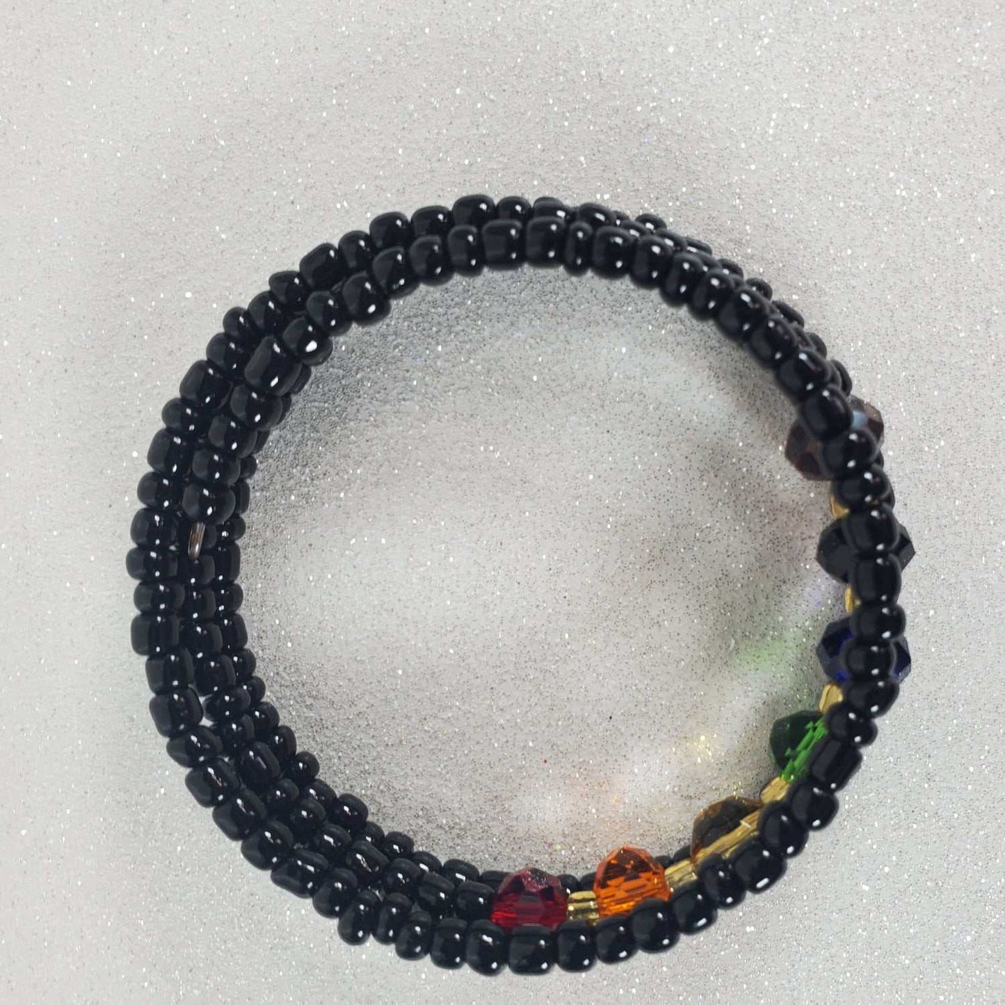Rainbow Crystal Cuff Bracelet with vibrant multicolored crystal beads and adjustable memory wire design