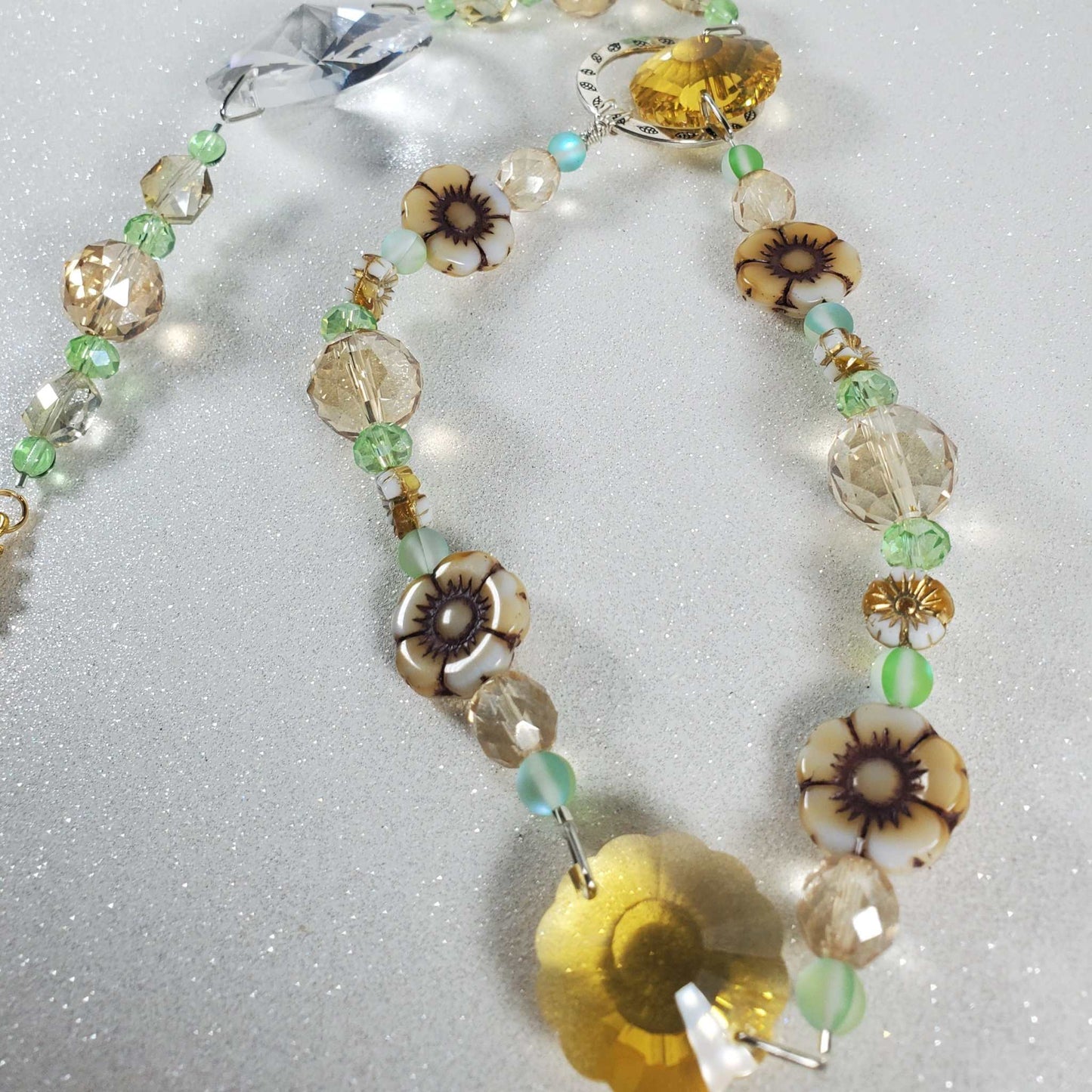 Sunflower crystal suncatcher with topaz flower prisms, white Czech glass flowers, and green beads
