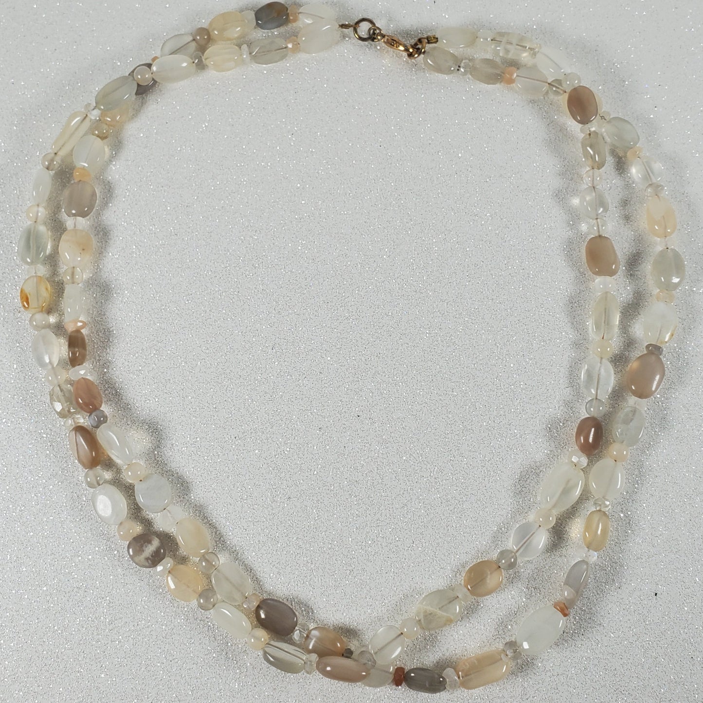 Beaded necklace on a light gray background