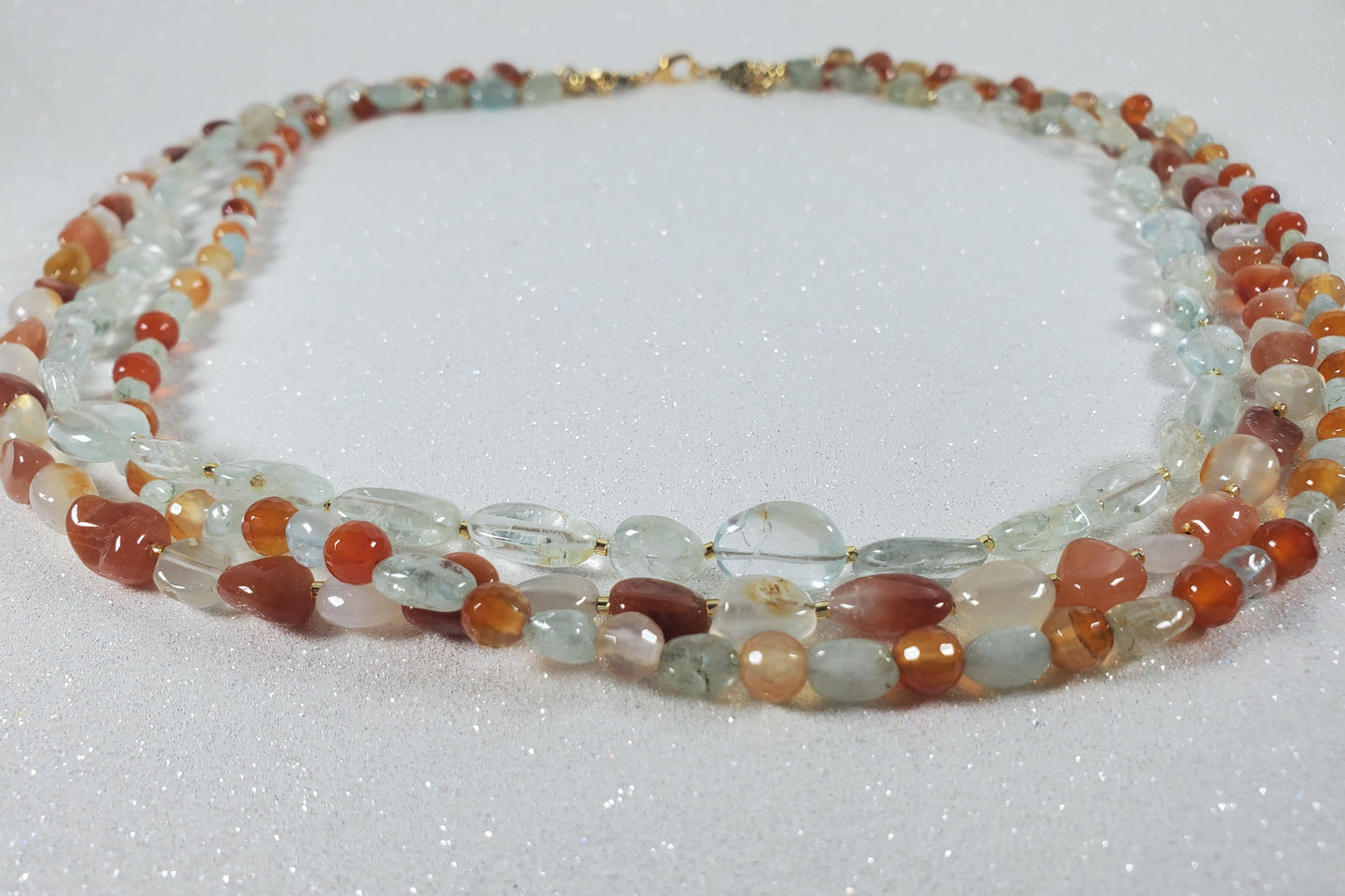 Beaded necklace with multicolored beads on a white background