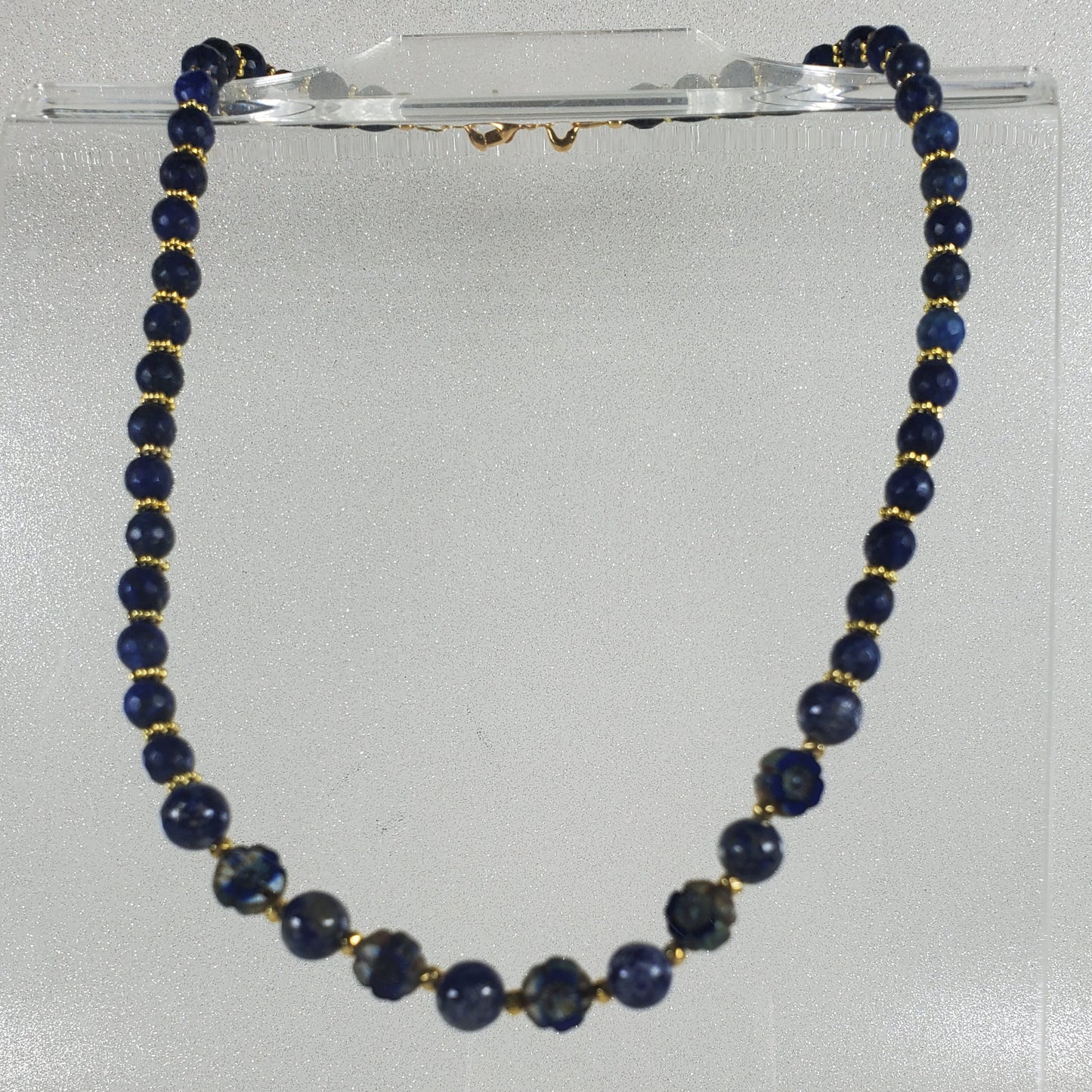 Necklace with blue beads on a white background