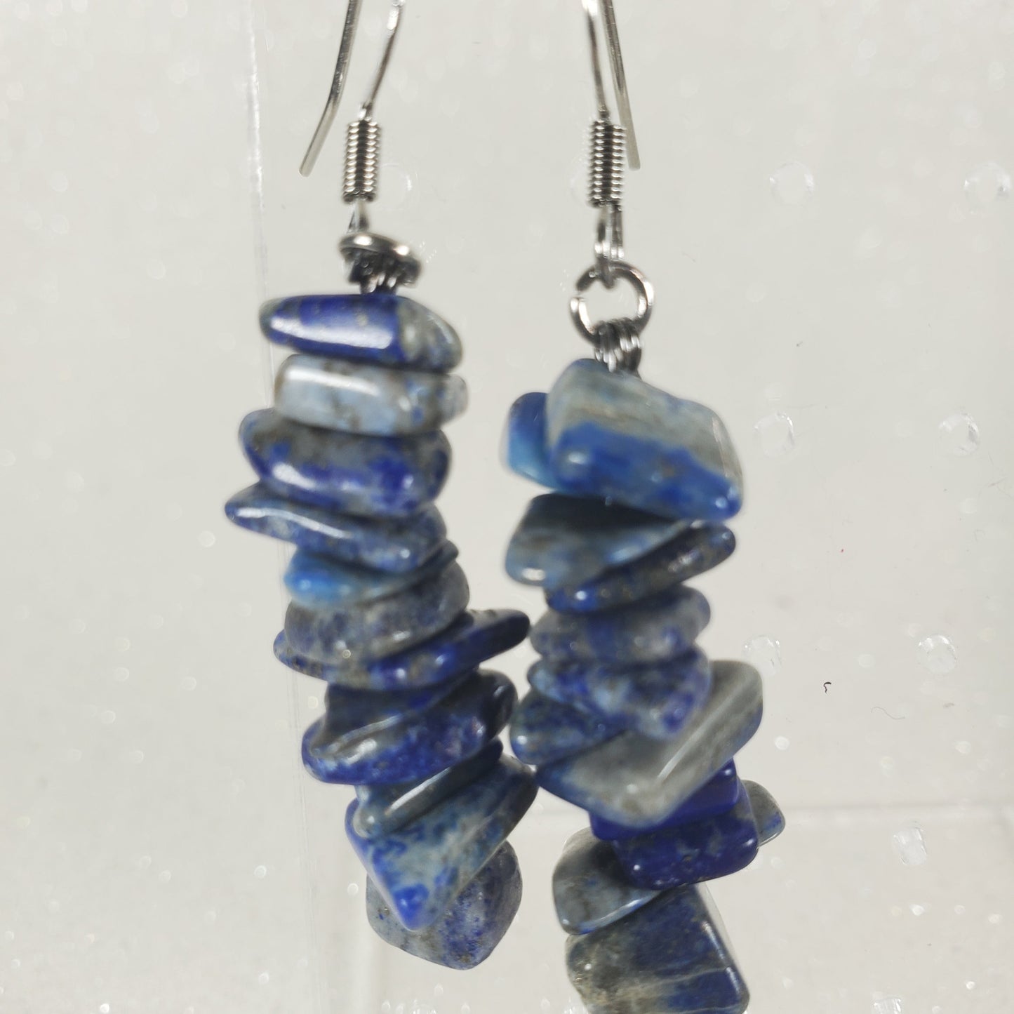 Blue stone chip earrings on a white background
