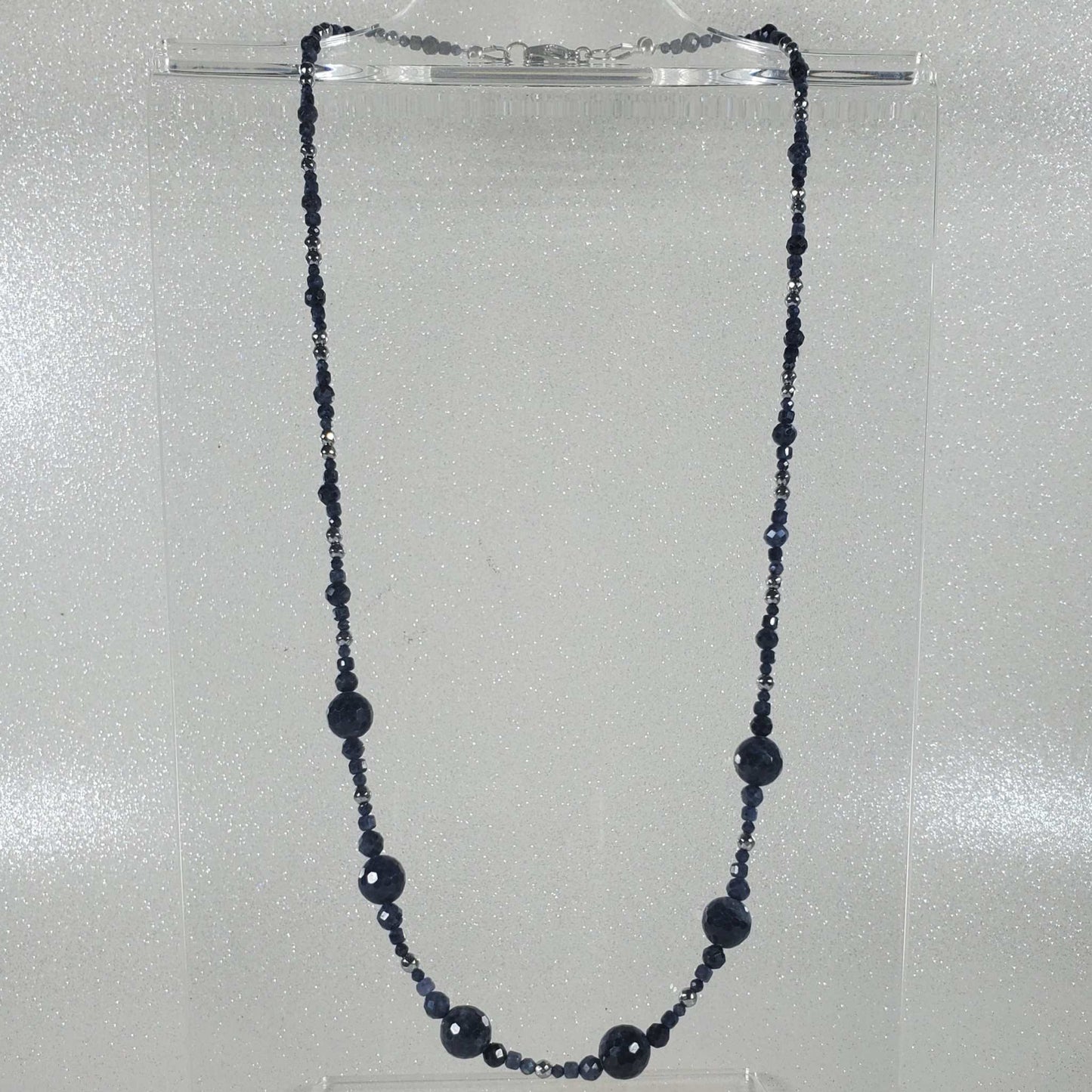 Elegant gemstone necklace with graduated deep blue sapphire beads and silver hematite accents, 20-inch length