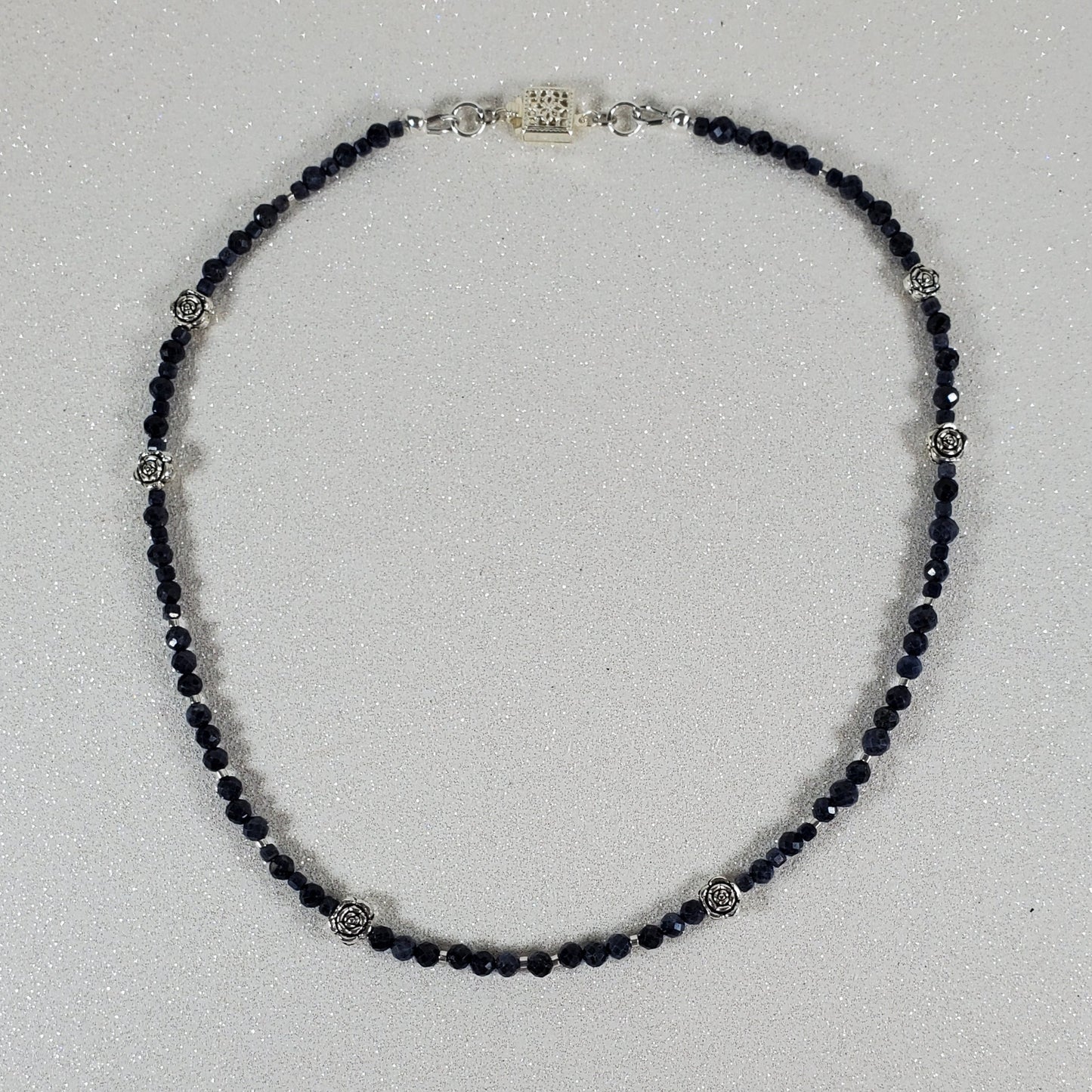 Beaded necklace on a light gray background