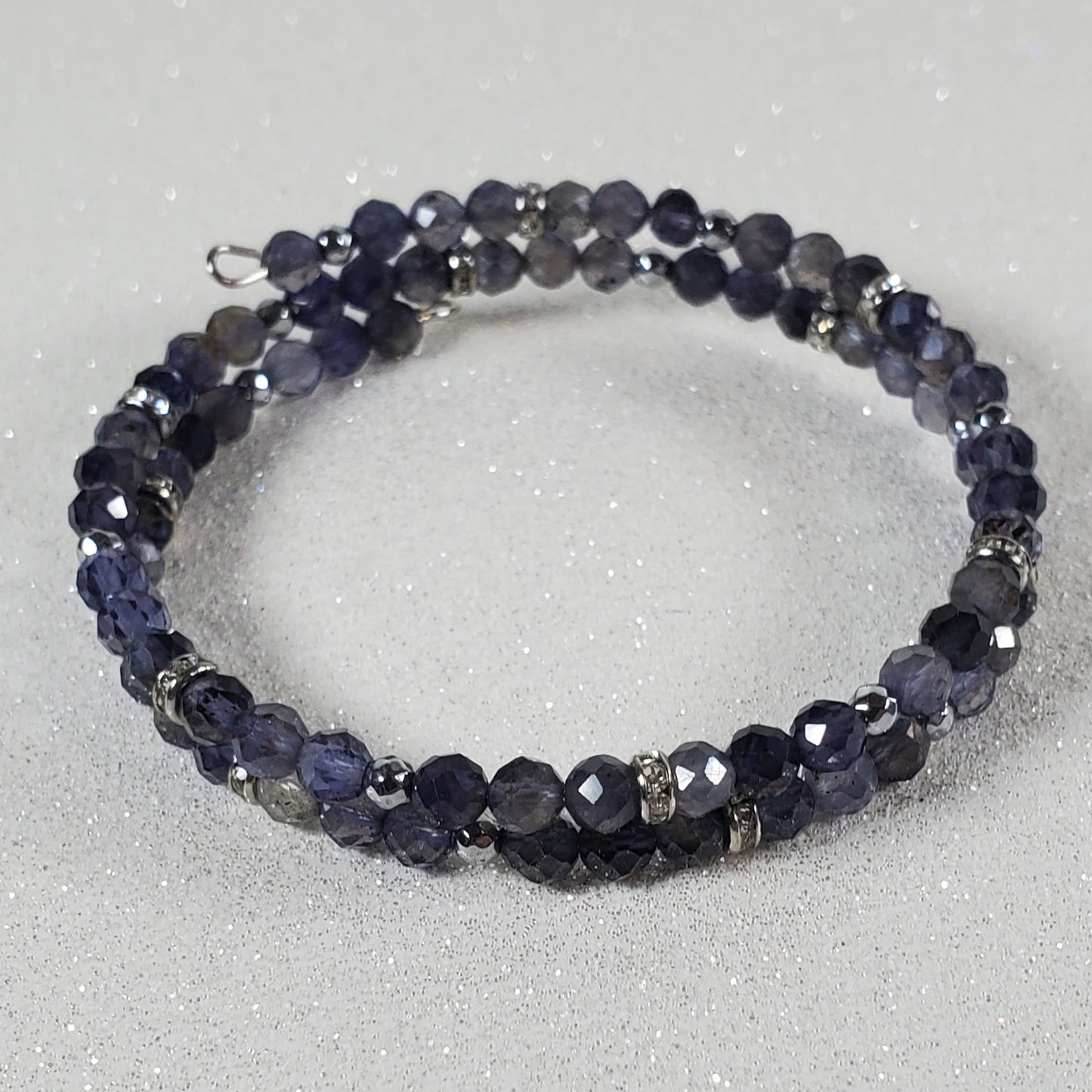 Beaded bracelet on a textured gray surface