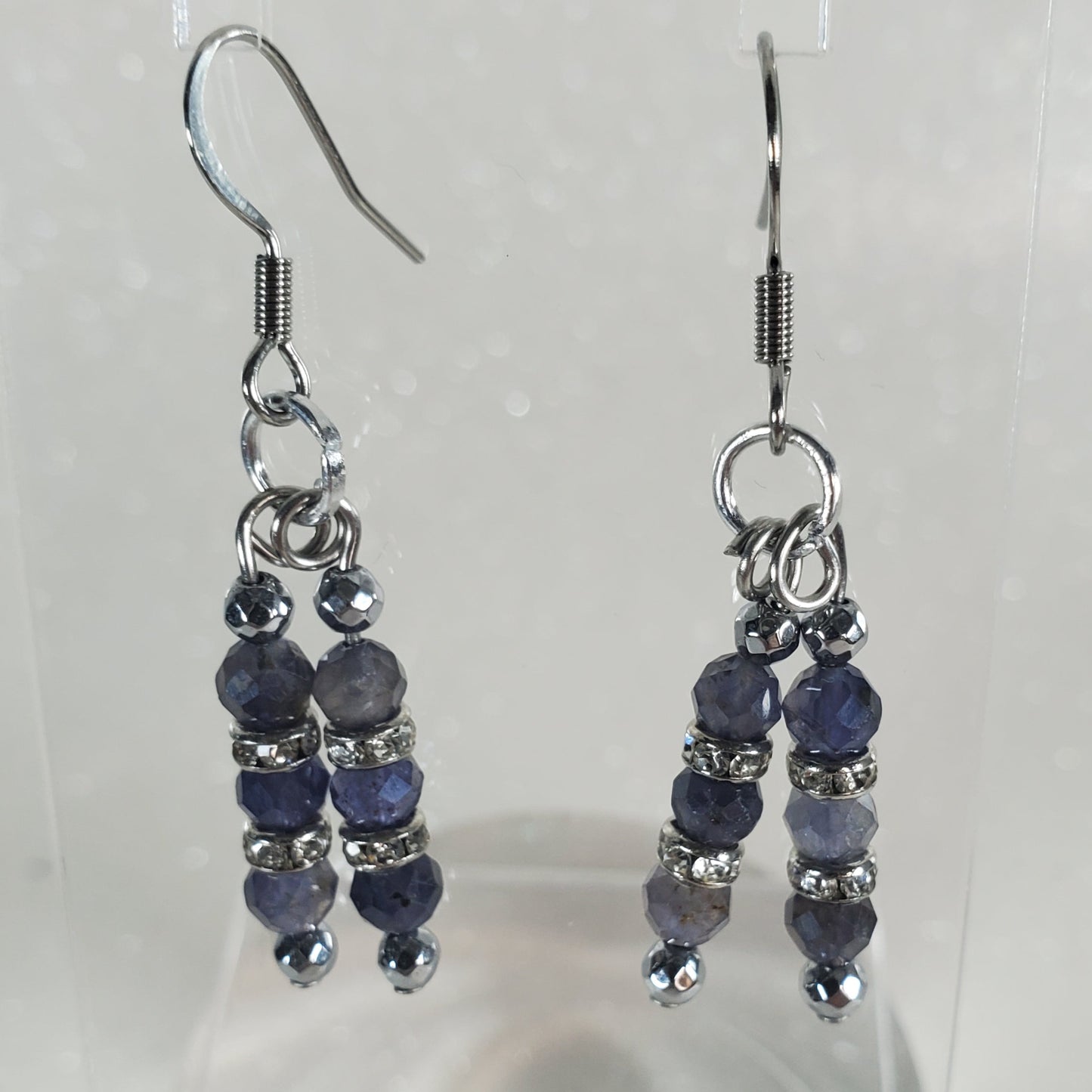 Pair of beaded earrings on a white background