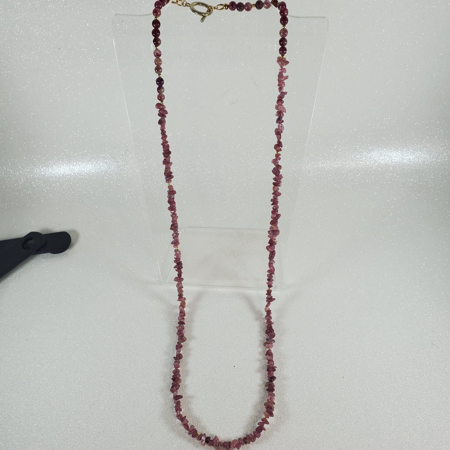 Beaded necklace on a white surface