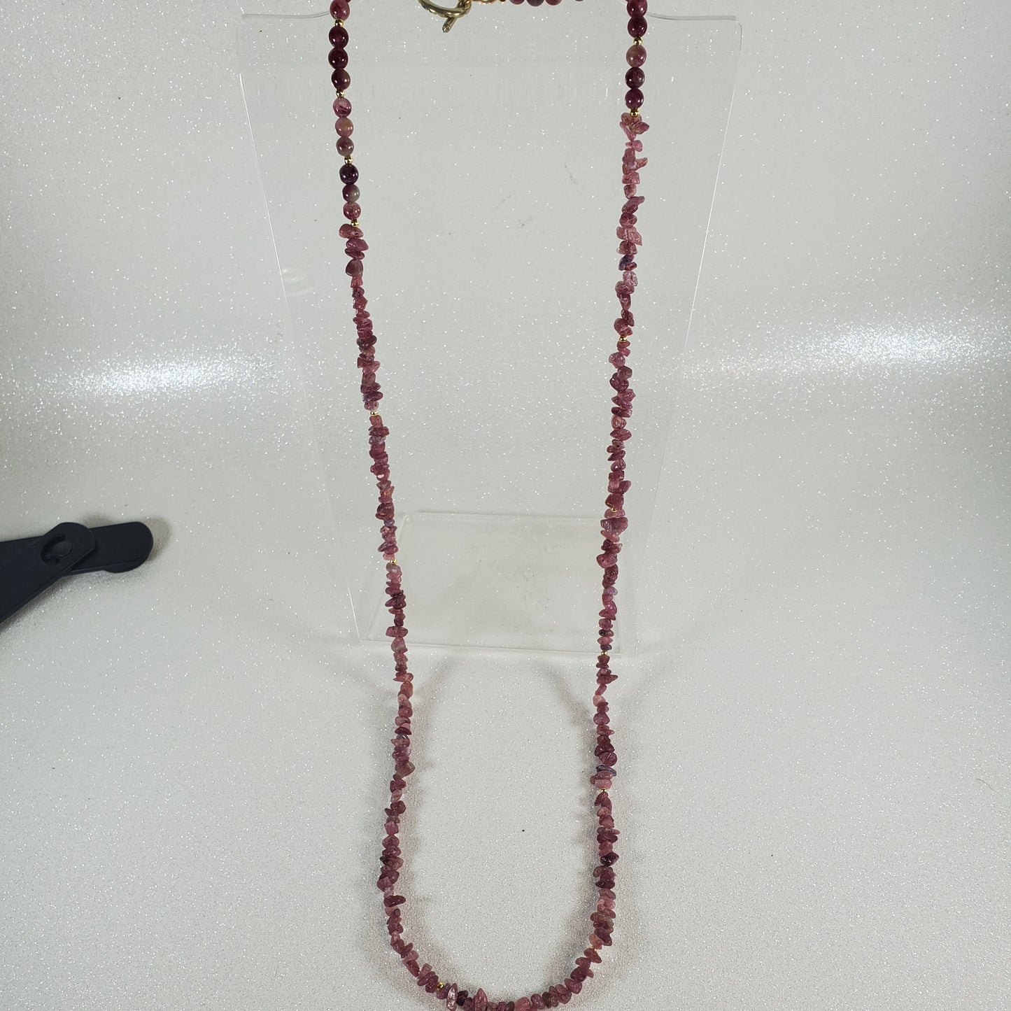 Beaded necklace on a white surface