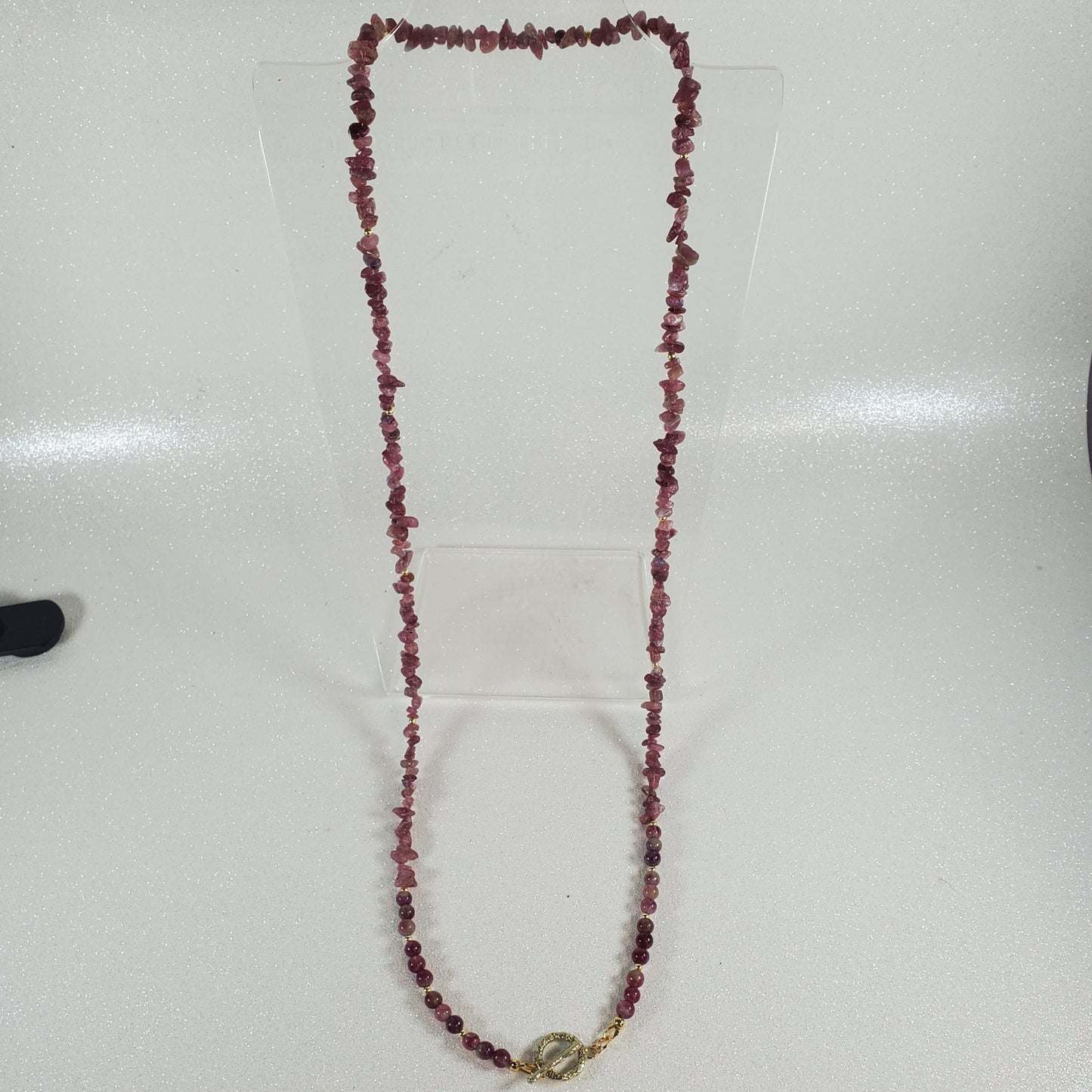 Beaded necklace on a white surface
