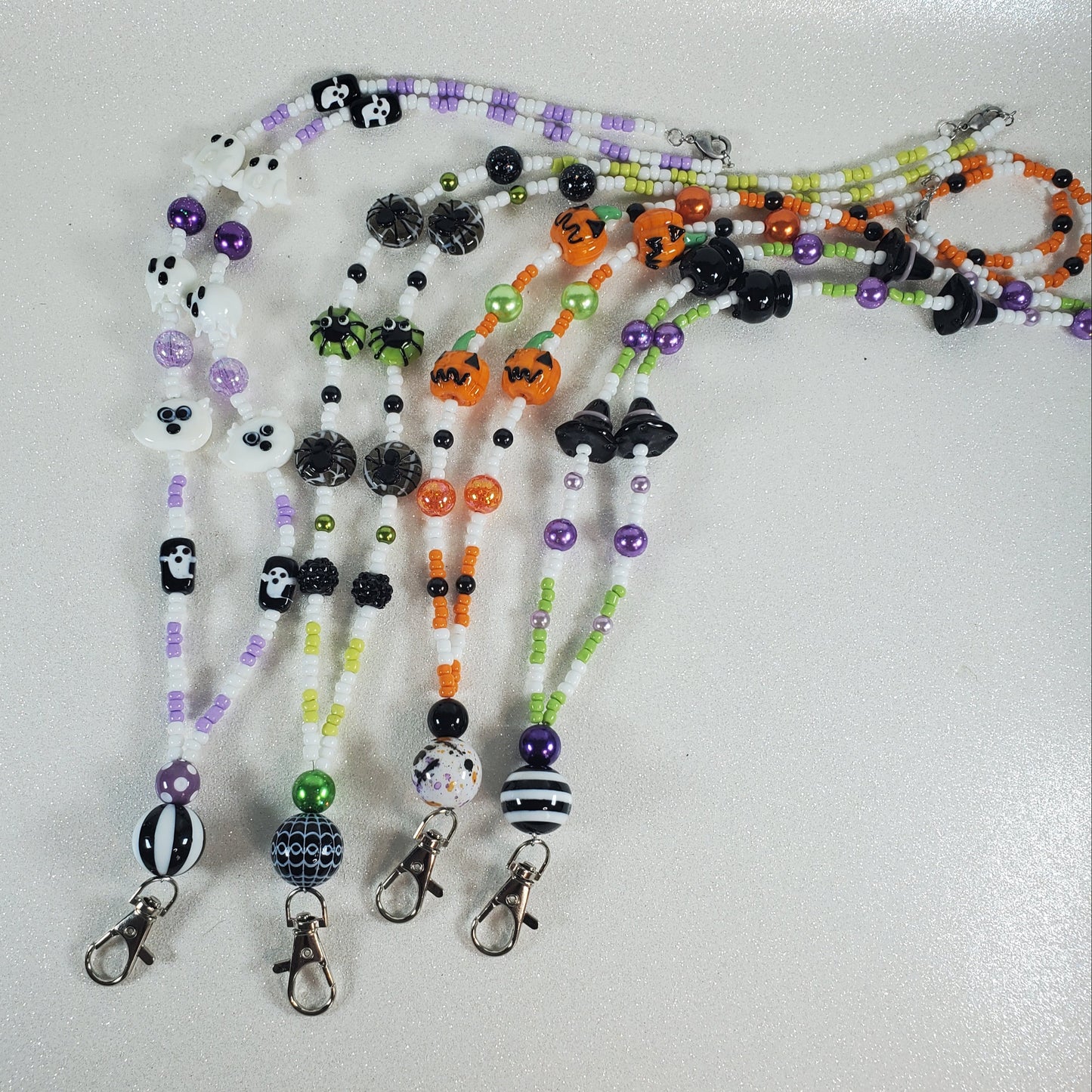 Set of Halloween-themed beaded lanyards on a white background