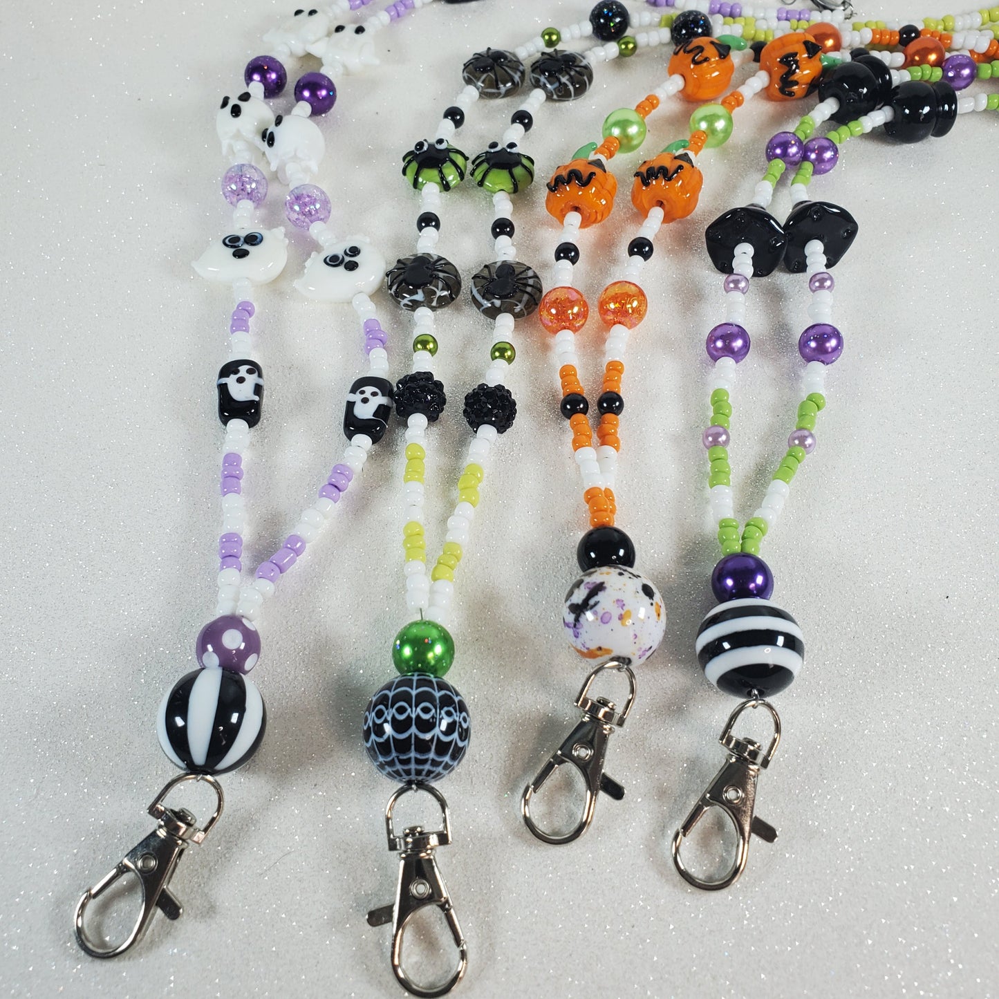 Set of Halloween-themed beaded lanyards on a white background