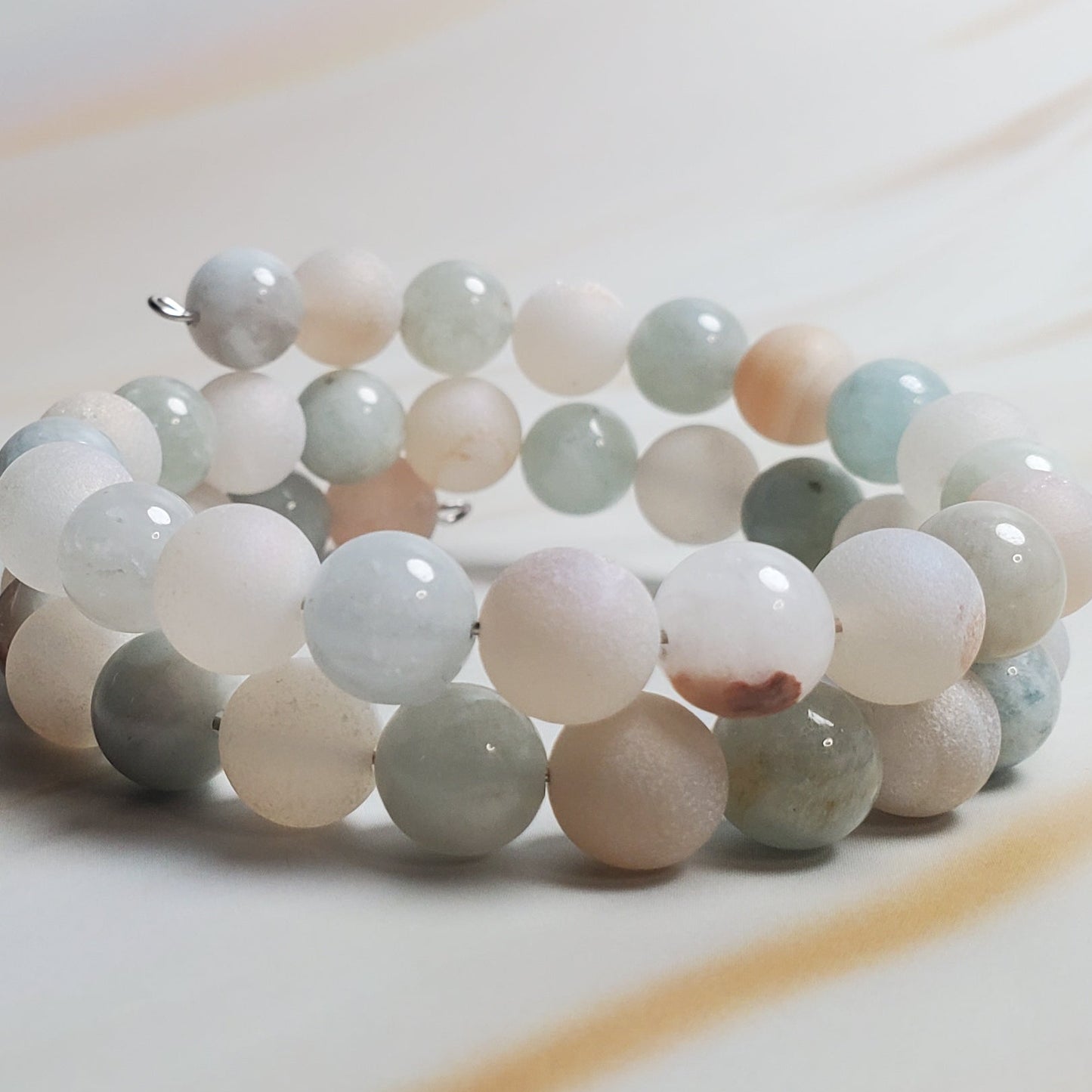 Multicolored beaded bracelet on a light wood surface