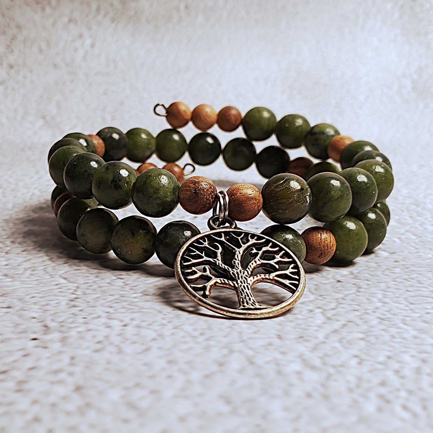 Handcrafted gemstone bracelet with genuine Chinese jade, natural wood beads, and a pewter Tree of Life charm on flexible memory wire