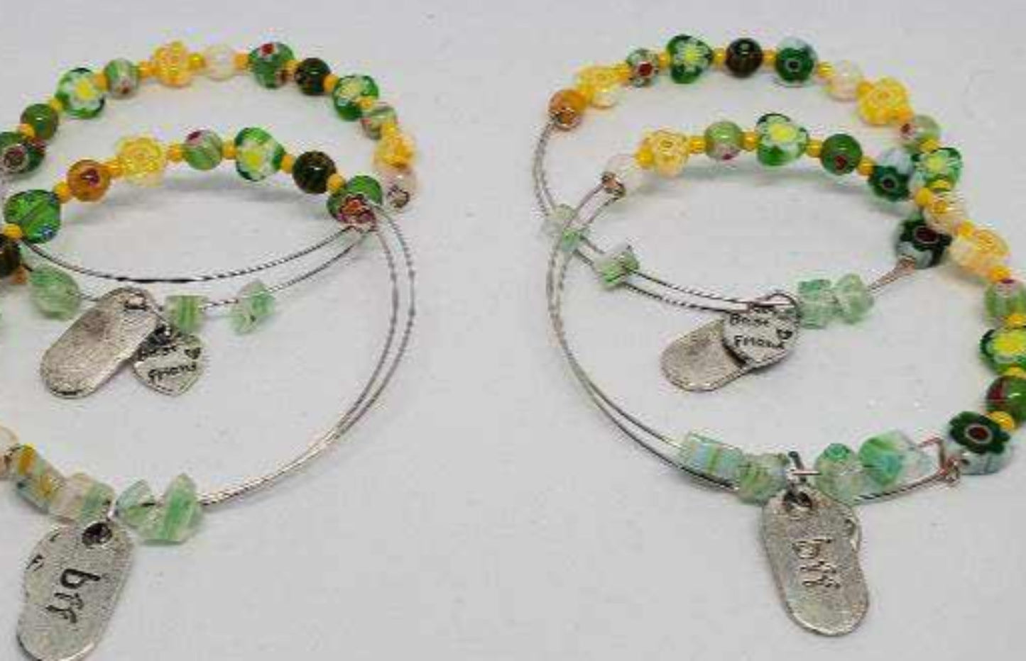 Two-piece colorful Millefiori glass charm bracelet set with pewter friendship charms on flexible memory wire
