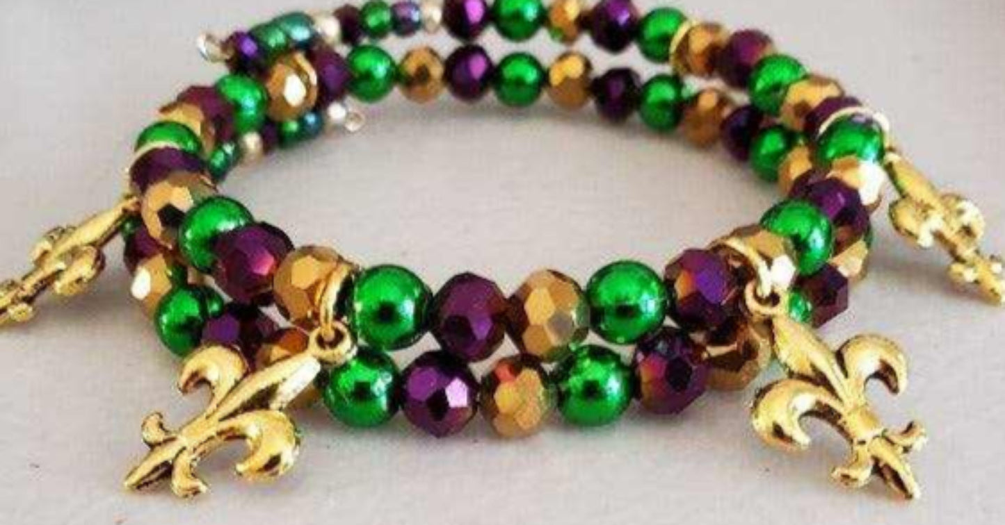 Mardi Gras charm bracelet with green, gold, purple beads and fleur-de-lis accents