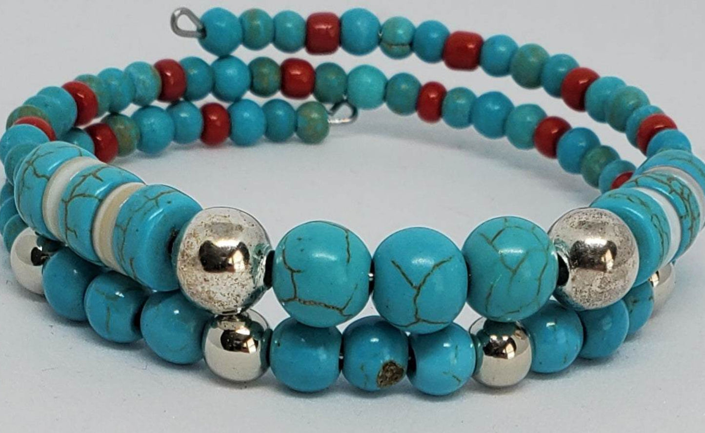 Southwestern style gemstone bracelet with turquoise, silver, and red beads in a cuff design