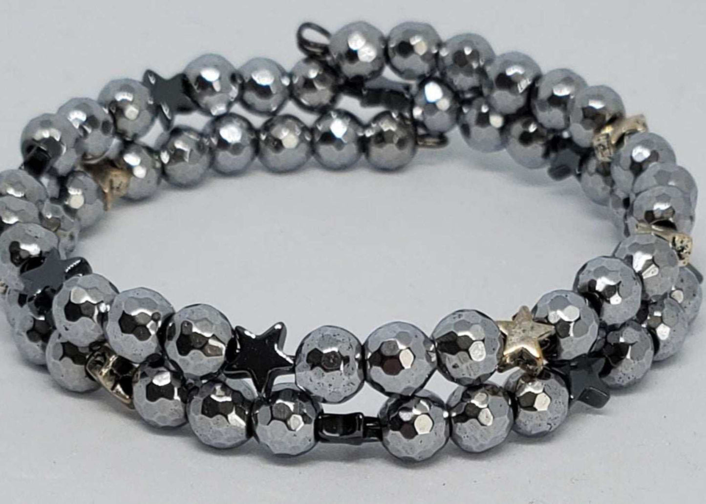 Gemstone bracelet with silver faceted beads and dark grey hematite star accents in a double wrap cuff design