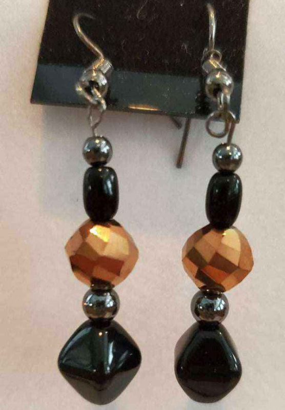 Handcrafted necklace and earring set with black beads and metallic gold accents