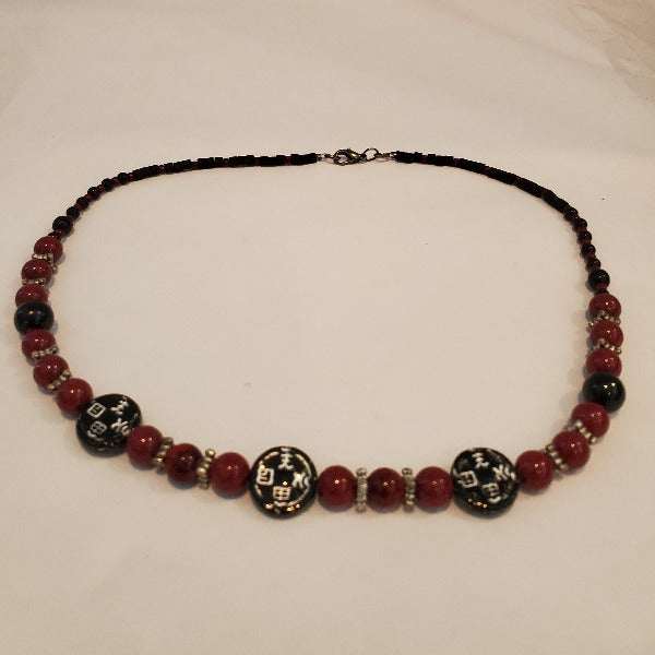 Vintage Fashion Far East Necklace with acrylic Asian coin beads, red and black glass beads, and pewter accents.