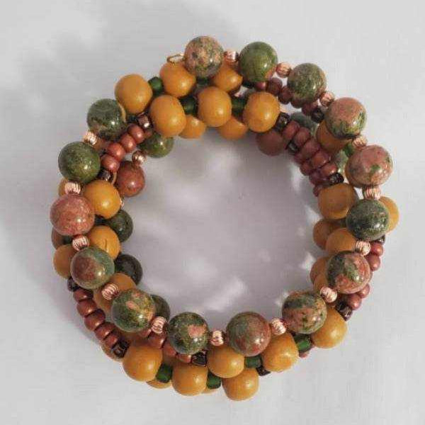 Handcrafted autumn-themed gemstone bracelet with Jasper, Unakite beads, wood, copper, and glass accents on memory wire cuff