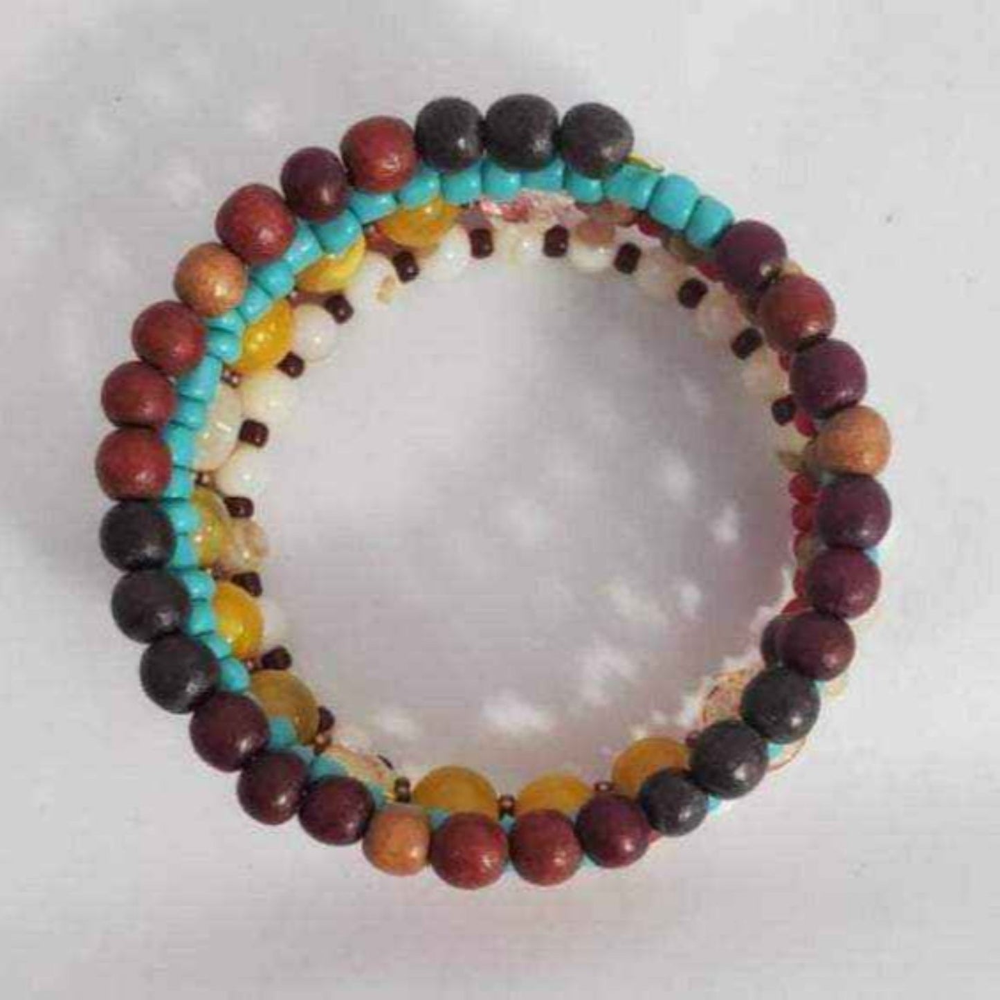 Bohemian Bracelet featuring citrine gemstones, natural wood beads, and shell accents on flexible memory wire