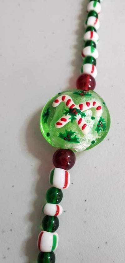 Christmas Bracelet with candy cane lampwork bead and festive red, green, and white vintage glass beads
