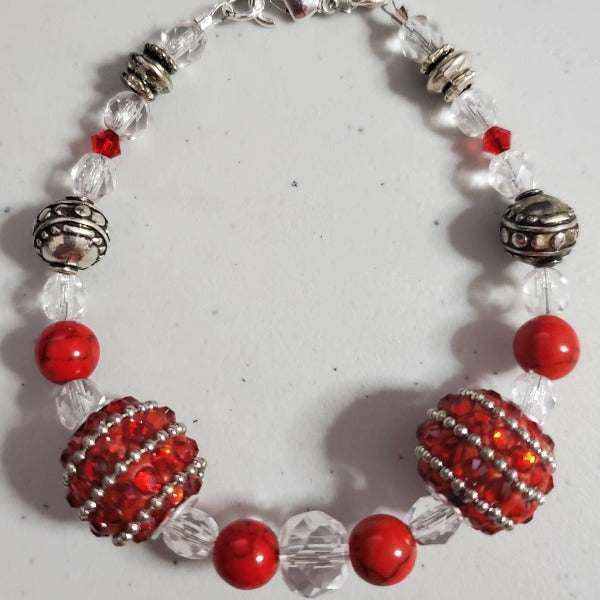 Red Rhinestone Bracelet with silver beads and clear faceted crystals, 7.5-inch lobster clasp closure, elegant and sparkling jewelry accessory.