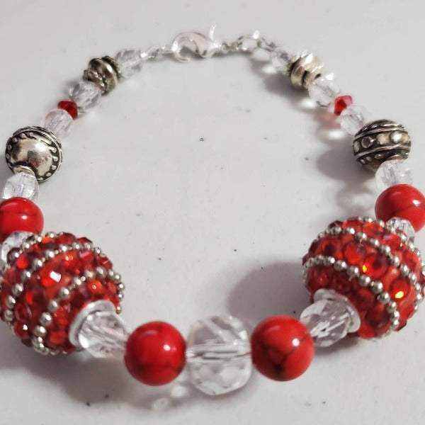 Red rhinestone bracelet with silver accents and clear beads, lobster clasp closure