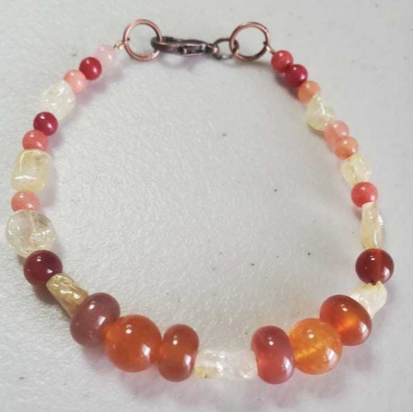Handcrafted carnelian and citrine gemstone bracelet with lobster clasp, 7-inch length, warm energizing colors