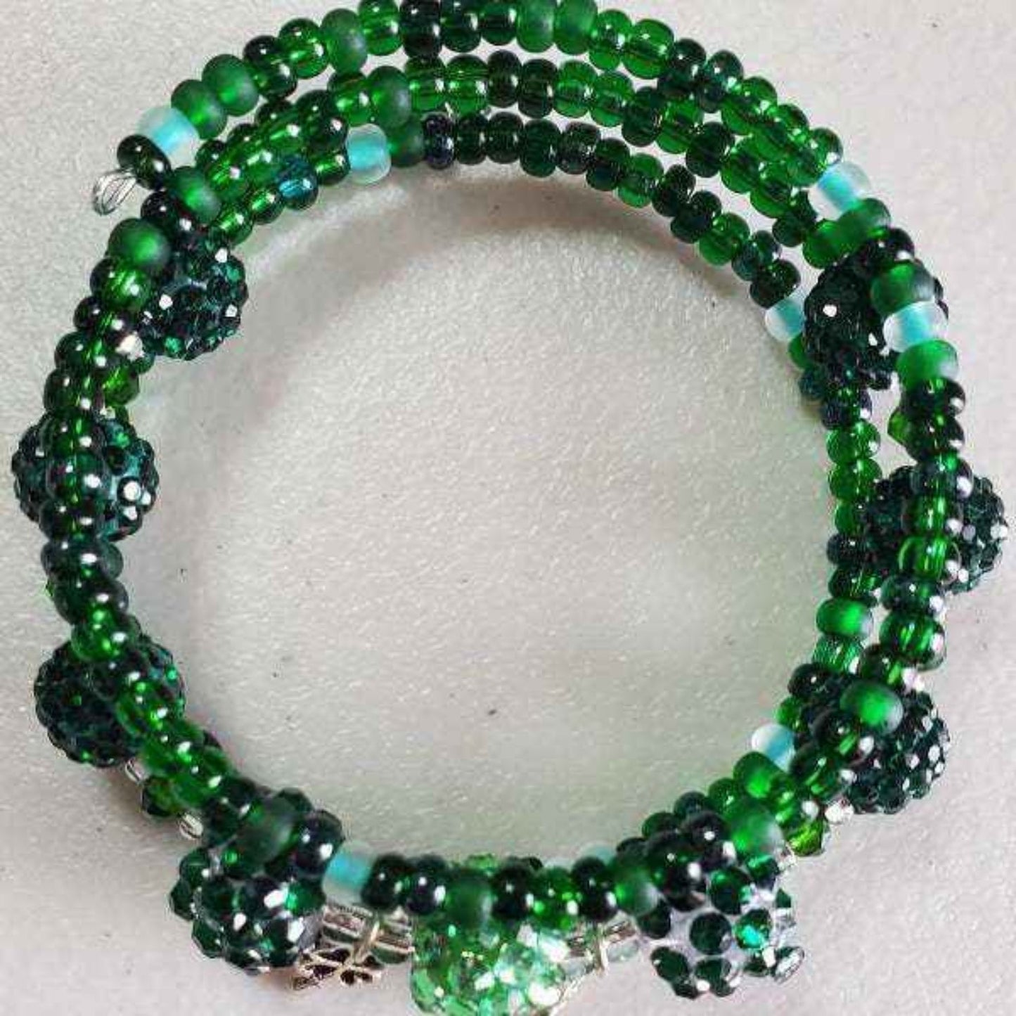 Green bohemian cuff bracelet with shamrock charms and crystal beads